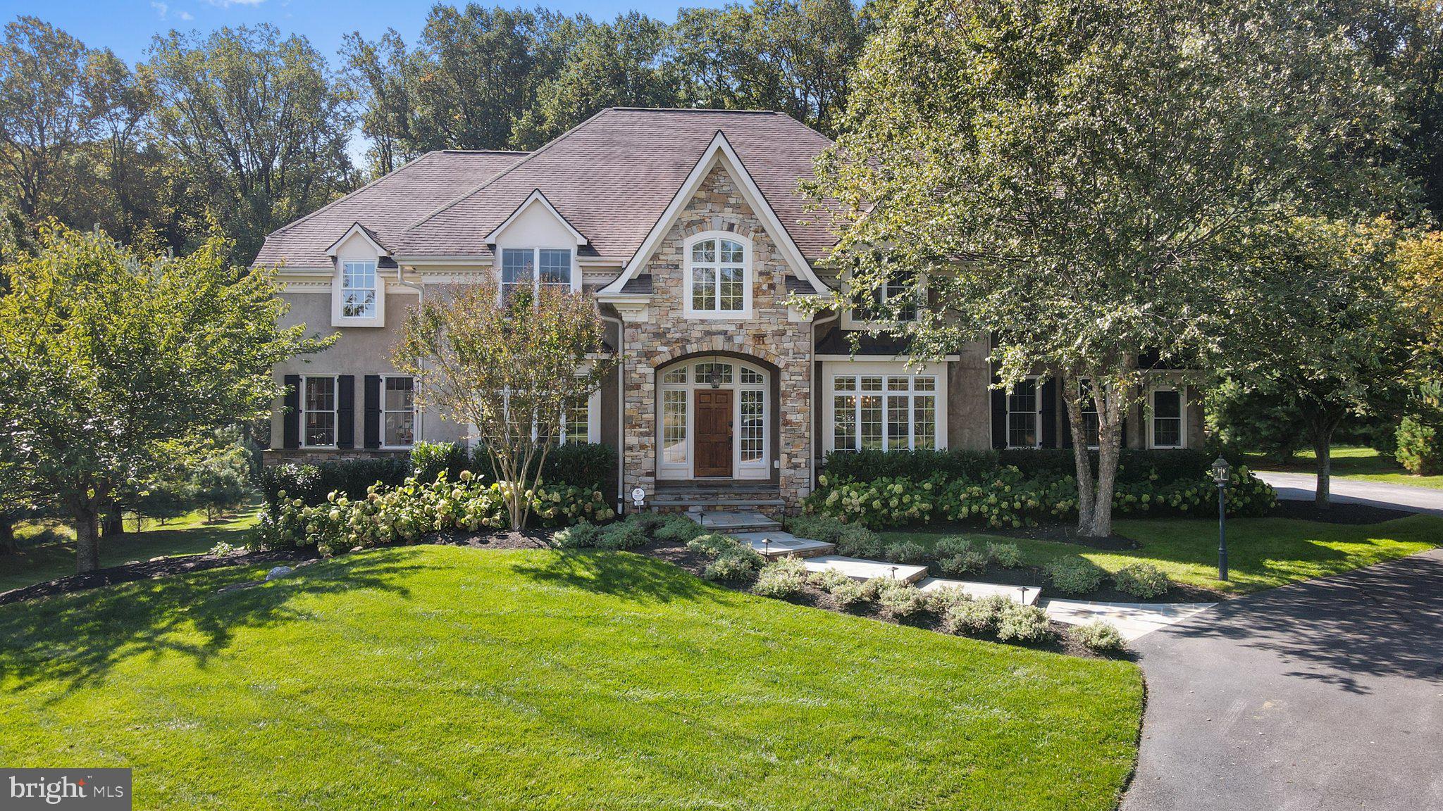See attached virtual tour of this wonderful home located in the private community of Kintera.

Welcome to 101 Hidden Pond Drive - a custom built Bentley home in the beautiful neighborhood of Kinterra!  Once the model home, this five-bedroom, 3.5-bathroom house features an open floor plan and many luxury features. As you walk up to the home you are greeted by a new flagstone pathway. Enter the two-story foyer where you have views of the formal living room and dining room both showcasing floor to ceiling windows.  Continue inside to the large family room which features a floor to ceiling gas fireplace, along with a wall of windows that overlook the stunning backyard. This room flows into the luxurious kitchen which features: Wolf professional cooktop, a built-in pot filler, 36" Subzero refrigerator/freezer with matching wood panels, granite counter tops, a double sink, large island, a built-in double wall oven, built in microwave, and a desk area.  The kitchen area is completed by a separate breakfast nook. Off the kitchen, there is a butler's pantry, mud room, two storage closets, a back set of stairs and a 3-car garage which have floor to ceiling shelving. To finish the first floor, there is a powder room plus 2 extra rooms that could be used as a den, office or playroom. All rooms on the first floor have custom Hunter Douglas shades and hardwood throughout!

The second floor has new hardwood flooring in all 5 bedrooms as well as custom blackout shades. The main bedroom features a custom walk-in closet, along with a full bath featuring a kohler tub and double shower. There is a guest room with private bath. The remaining 3 bedrooms share a hall bath. The laundry room is on the same level and features custom cabinets and more storage. 

The unfinished basement has a walk out with windows, along with rough in plumbing for a full bath.
Outside, a newly built flagstone path connects the driveway to the large deck that overlooks the open field backyard. Privacy trees have been planted on both sides of the home.

A new security system with cameras has been installed both inside and out, as well as new carbon monoxide and smoke detectors along with a house generator. 

The yearly HOA fee covers: Trash/recycling collection, 2 septic inspections per year, discounted lawn care, common area maintenance and neighborhood walking path.