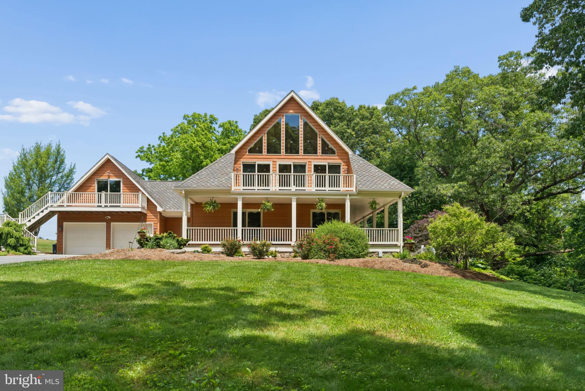 Private 20-acre retreat offering the perfect blend of quality construction, comfort and versatility. Built in 2005 with energy efficiency in mind, this custom home features 2x6 exterior walls, double hung Pella windows, an insulated concrete foundation and a 50 year architectural roof. The open floor plan is highlighted by a stunning two story stone fireplace and abundant natural light. Enjoy the peaceful setting from multiple decks and a beautiful patio overlooking the property. Approximately 15 acres are cleared, creating endless possibilities for your agricultural use. Above the garage, a 23x17 unfinished bonus space is ready for your vision. A truly unique property offering privacy, flexibility and room to grow. Schedule today!