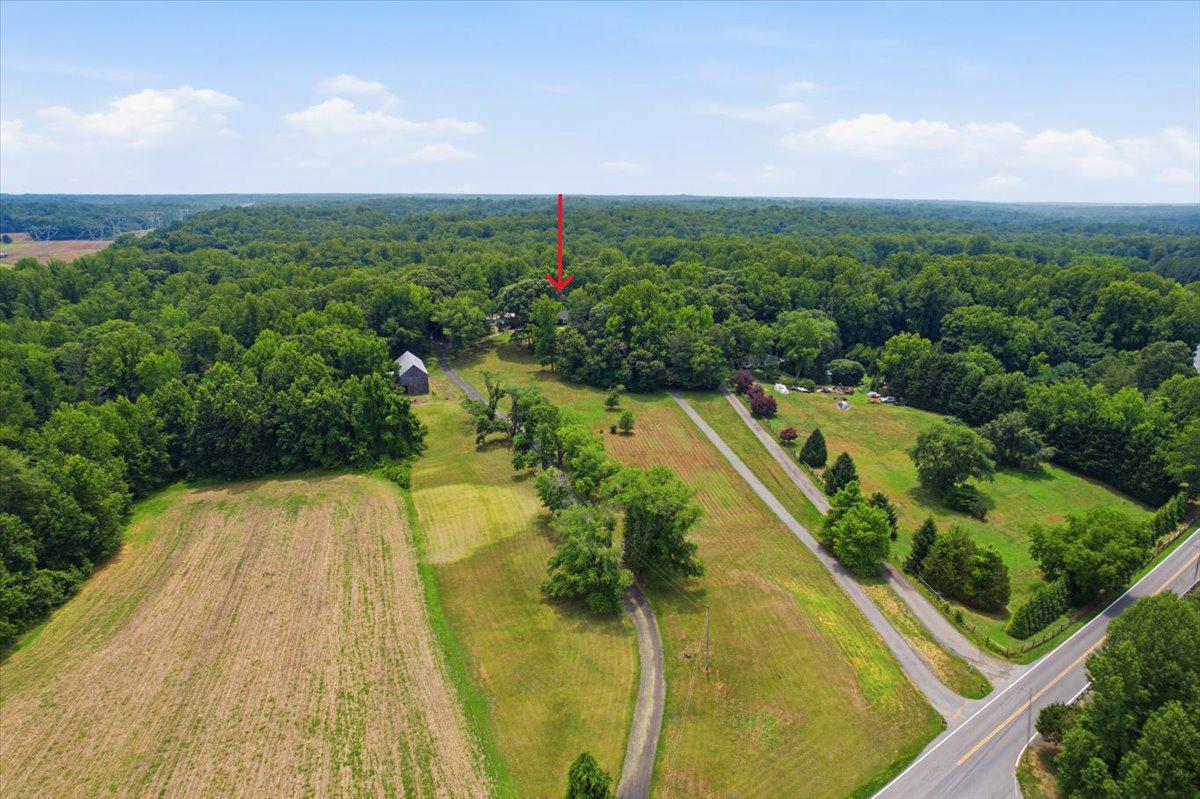 COUNTRY LIFE with LUXURY! This is the perfect sized farmette with great character in an incredible Huntingtown location. The property includes a fully renovated 4BR/3.5BA home on two floors, a huge 70 x 30 tobacco barn with electric, a 30 x 50 detached 3 bay garage with a 4th sub-level storage bay, and a very memorable view over the acreage.  The main house interior and the entire exterior was renovated with high quality materials and finishes in 2024. The 2BR/1BA in-law apartment and the basement was just completed in 2026. Do not miss the prettiest gourmet kitchen with an incredible appliance package and high end finishes!! Also, look for the luxurious primary bathrooms (yes, 2 primary baths) you've ever seen. The guests/in-laws will be thrilled with the 2BR/1BA fully renovated separate wing of the house. It has its own large living space, and large bedrooms. The outdoor living spaces are essential to get full enjoyment, and that includes a covered front porch, a screened porch, a deck, and a covered patio on the lower level. Did we mention the gorgeous rolling land with resident wildlife such as wild turkey, whitetail deer and an incredible bird population? Some equipment is for sale-see Agent remarks. The price is right-do not wait on this one.