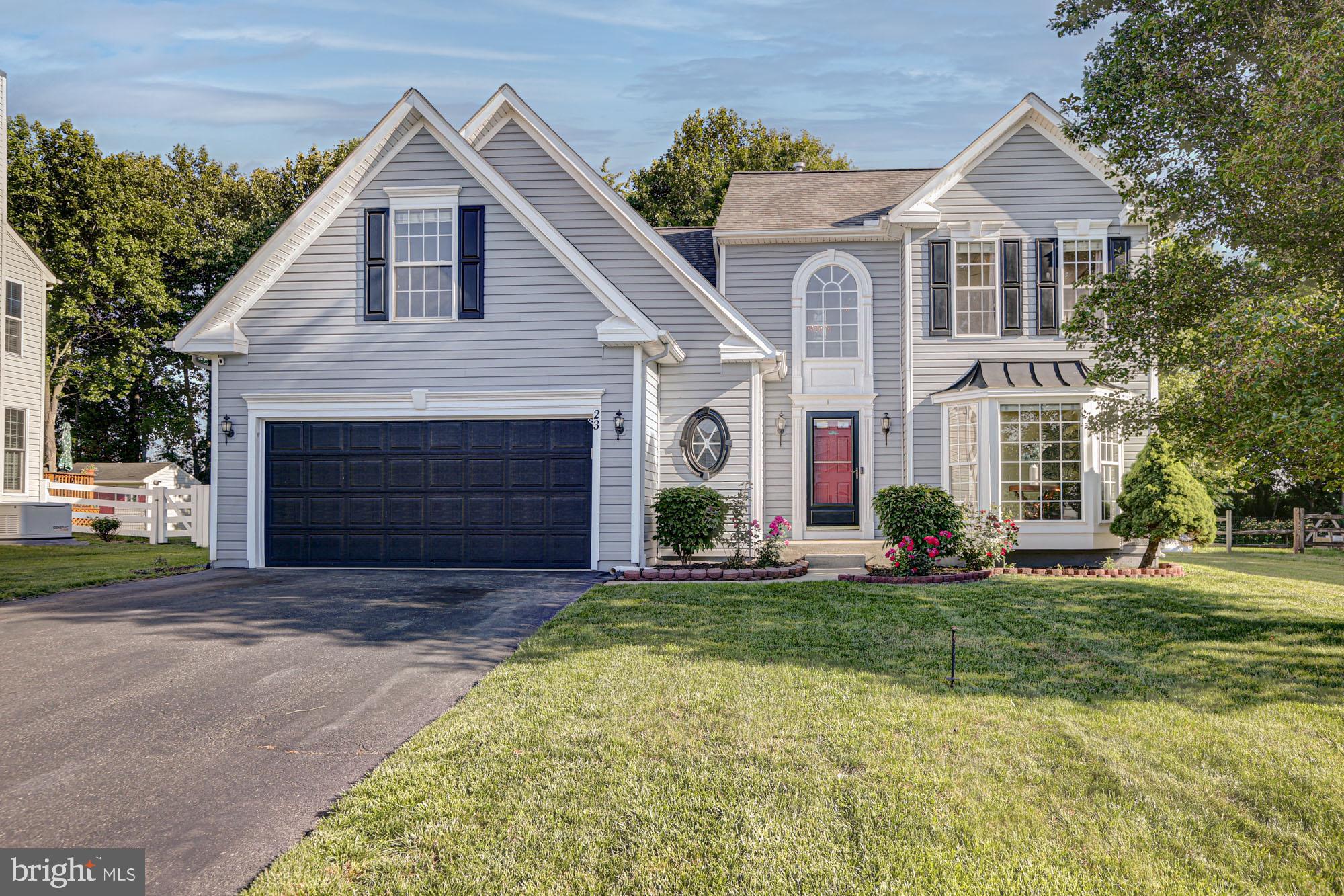 Welcome to 23 Browning Circle, where comfort, privacy, and thoughtful design come together in one of Middletown's most desirable communities.

Nestled in the sought-after community of Middletown Crossing and located within the acclaimed Appoquinimink School District, this beautifully maintained home offers the perfect blend of spacious living, modern updates, and a backyard setting that is increasingly difficult to find.

From the moment you arrive, you'll appreciate the pride of ownership throughout, including a new roof (2023), dual-zone HVAC, and fresh exterior paint (2021). Inside, soaring ceilings, abundant natural light, and an open-concept layout create an inviting atmosphere ideal for both everyday living and entertaining.
The heart of the home features a spacious kitchen that flows seamlessly into the dining area, living room, and a sun-filled sunroom, creating the perfect space to gather with family and friends. The dramatic family room is highlighted by cathedral ceilings and expansive windows that bring the outdoors in.

A highly desirable feature, the home offers a first-floor primary suite complete with a private en-suite bath, providing comfort and convenience for homeowners seeking first-floor living. Also on the main level is a versatile formal sitting room, ideal as a home office, playroom, reading room, or additional living space.
Upstairs, you'll find three generously sized bedrooms, an additional full bathroom, and a flexible loft-style sitting area perfect for a homework station, reading nook or game space.

The finished basement expands your living space even further and has been freshly painted in 2025, offering endless possibilities for recreation, fitness, hobbies, or entertaining. An unfinished section provides valuable storage space.

Step outside and discover what truly sets this property apart. The fully fenced backyard (2019) backs to protected open space that cannot be built upon, creating a peaceful and private setting surrounded by mature trees. Enjoy summer evenings on the deck, entertain guests with ease, or simply relax while taking in the tranquil views. And your garden will stay lush with the added drip system that waters your planters in the backyard. As an added bonus, you'll enjoy watching local fireworks displays from the comfort and privacy of your own backyard.

Offering the perfect combination of space, privacy, updates, and location, 23 Browning Circle is the type of home buyers wait for. With its flexible floor plan, beautiful outdoor setting, and prime Middletown location, this is an opportunity you won't want to miss.
