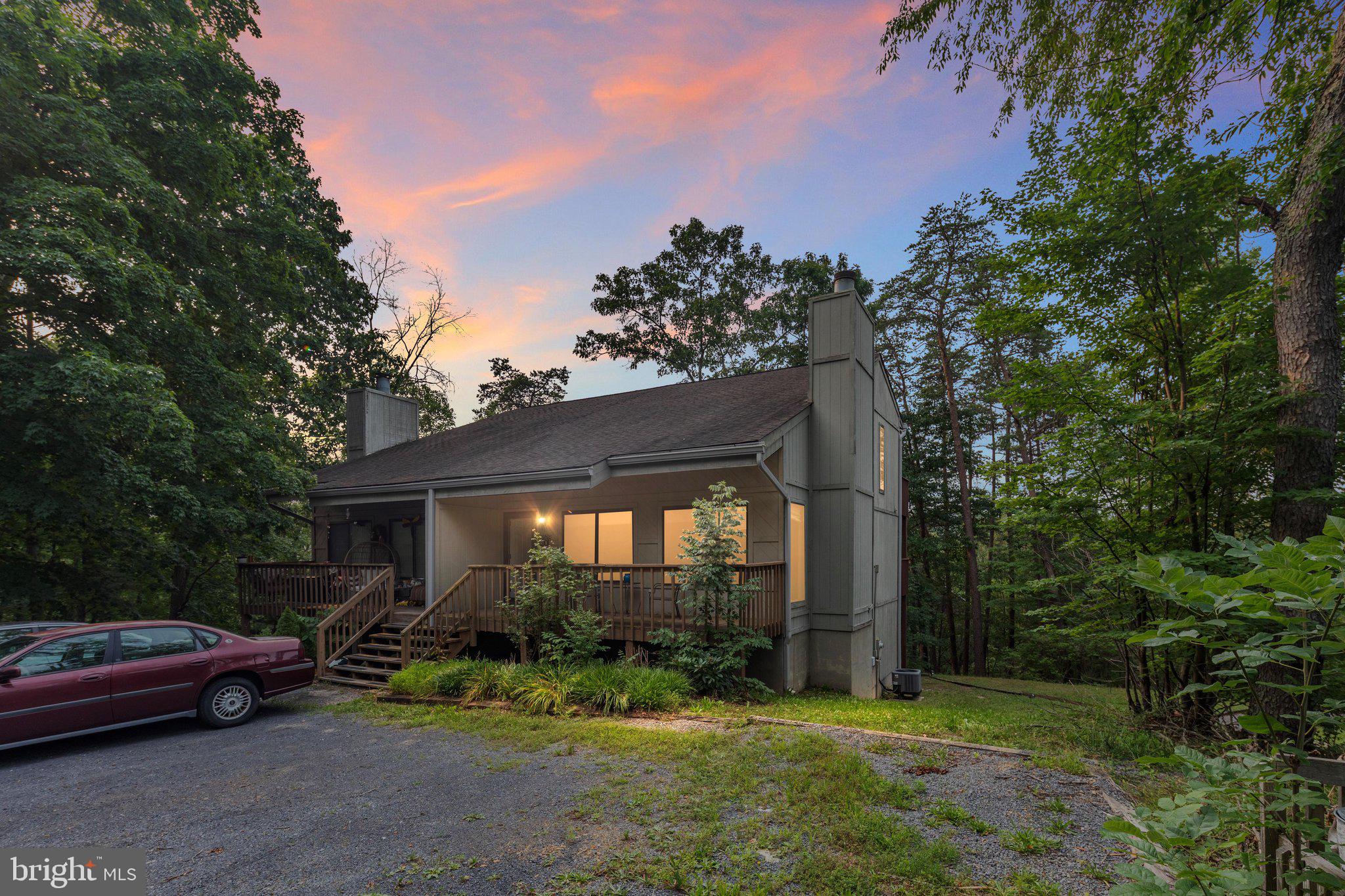 This immaculate 3-story home offers 3 bedrooms and 3 baths. The upper level has an open floor concept for the kitchen, dining room, and living room with a fireplace to enjoy a cozy fire. 1 Bedroom on the main level and a full bath. The 2nd level has a primary bedroom and bathroom with a sauna to relax in. There is a deck off each bedroom to sit and enjoy the peaceful surroundings. The bottom unit that is not connected to the upper level has an open floor concept with a full kitchen, dining room, and living room combination. There is 1 bedroom and 1 bath. The unit is close to Bryce Resort, Lake Laura, and many walking trails. This would make a great primary home or even a second home. If you are interested in additional income, use it as an Airbnb, renting one or both units. This house comes fully furnished. Call before this beauty is gone.
