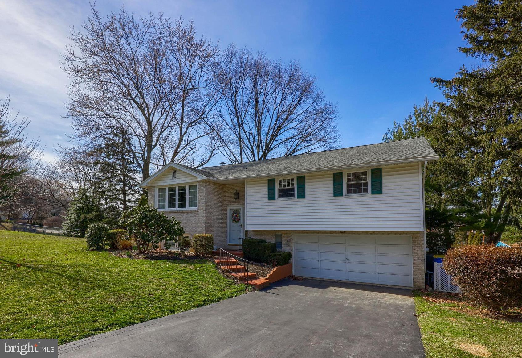 This classic all-brick split foyer home is ready for its next owner to make their own memories!  You'll immediately be impressed as you enter the home!  This home has been lovingly cared for over the years.  The oversized living room flows effortlessly to the open dining area and into the kitchen.  There's plenty of cabinetry and two built in pantries!  The seamless Corian countertops are a great compliment to the elegant raised panel cherry cabinetry.  Whether you are looking for space for a quick bite at the breakfast bar or you are looking for a spot to host dinner parties, this space has it for you!  The skylight and the newer insulated replacement windows provide plenty of natural light in the home!  Each of the bedrooms have ample sized closets and the authentic hardwood floors in the bedrooms deliver a quality classic feel in the home.  The primary bedroom has plush neutral carpeting in the room for those that prefer a cozy cushy feeling under their feet!
Not to be outdone, the lower level area is surely a spot to enjoy!  There's another bedroom and full bath which is ideal for guests or a claiming spot for the teenager in the family!  The family room is anchored by the wood burning fireplace and stone surround!  Be sure to see the patio area that is just off the family room and features ceramic tile flooring and a wooden swing!   
The home has an oversized wood deck off the dining room that delivers great views of the east end of York County day and night!  The storage shed in the back yard has electric to it and is included in the sale!  There's so much for you to see in this home.   Let us know what your favorite spot is!!