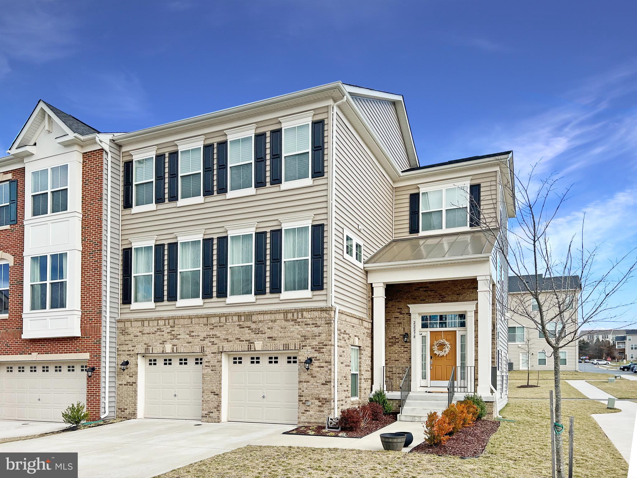 This stunning, sun-filled end-unit townhome in Brambleton offers spacious living across three beautifully designed levels. The lower level features an oversized recreation room perfect for entertaining or relaxing, along with a bedroom, full bathroom, garage access, and a walk-out to the backyard. The main level boasts an open-concept layout with a chef-inspired kitchen that includes a large center island, stainless steel appliances, and generous counter space—ideal for everyday living and hosting guests. Upstairs, you'll find the conveniently located laundry room, a full hall bath, and three additional bedrooms, including a light-filled primary suite complete with a luxurious en-suite bathroom featuring dual vanities and a large walk-in closet. The garage is EV charger-ready for added convenience. This home is a commuter’s dream with a bus stop right outside the community, just 2 miles from the Ashburn Metrorail Station, with easy access to the Dulles Greenway and only 10 minutes to Dulles International Airport. Located minutes from Briar Woods High School and other top-rated schools, you’ll also enjoy nearby Brambleton Park, golf, a movie theatre, shops, restaurants, and grocery stores—all within about a 2-mile radius.