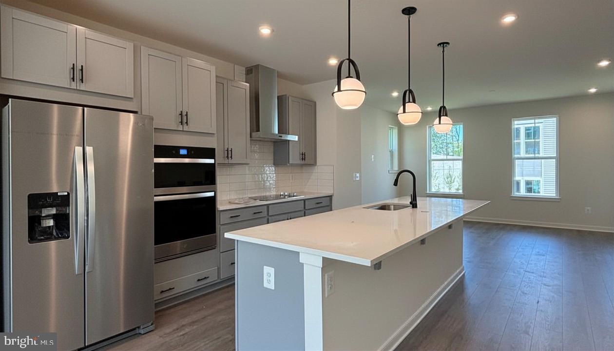NEW CONSTRUCTION. Special All-In Price, available for June Move-In! Until 6/10, take advantage of a 3.99% 5/1 ARM FHA rate (5.94% APR) with a Choice Lender*. With this 5/1 Adjustable Rate Mortgage, you can lock in a lower, predictable payment for the first five years. See New Home Counselor for Details. Hometown heroes get $5,000 until 6/10 (restrictions apply; see New Home Counselor for details). Discover the Belle, a stunning 3-level end-unit townhome with a 2-car garage in the highly desirable Cascade Landing community in Dumfries, VA. This spacious home offers 3 bedrooms, 3.5 baths, and 9 ft. ceilings for an open, airy feel. The gourmet kitchen is a showstopper, featuring upgraded stone shaker cabinets with gold hardware, pendant lighting, quartz countertops, tile backsplash, a large pantry, range hood, microwave/wall oven, and stainless-steel Whirlpool appliances. Designer laminate flooring flows throughout the main level, including the kitchen, great room, and foyer, creating a sleek, modern look. The luxurious primary suite includes a generous walk-in closet and a spa-inspired bathroom with raised double vanities, quartz countertops, and a ceramic tile shower with seat. A deck is off the main level to extend gatherings and relaxation. This home includes an additional full bathroom on the first floor, creating the perfect space to welcome loved ones or host overnight guests. Plus, the garage includes an EV charger- compatible outlet, making this home future-ready. Enjoy low-maintenance living with affordable HOA dues (no hidden developer fees) so you can put your savings toward what matters most. Cascade Landing offers a welcoming neighborhood with a playground, easy walkability, and quick access to premier parks and trails. Located just 2 minutes from Marine Corps Base Quantico (North Gate) and with direct access to I- 95, commuting is effortless. Commuters into DC and the surrounding areas will enjoy proximity to the Quantico Virginia Railway Express (VRE) Station (4.8 miles) and the Dumfries Commuter Lot with park and ride access (2.1 miles). Beazer Homes at Cascade Landing are designed to live better day to day, with energy‑efficient construction that lowers monthly utility costs, thoughtful design options that make personalization simple, and Mortgage Choice, where our top lenders help you compare options and save money on your home loan. This high‑performance home is built to lower your total cost of homeownership through reduced utility bills, durable materials, and high‑quality construction that minimizes long‑term maintenance costs. Plus, you’re close to Fortuna Center Plaza, Locust Shade Park, and dining favorites and entertainment. Photos of similar home. Model Home Hours: Mon–Sun, 11 AM–6 PM. Use 17910 Alicia Avenue, Dumfries, VA 22026 for GPS directions.