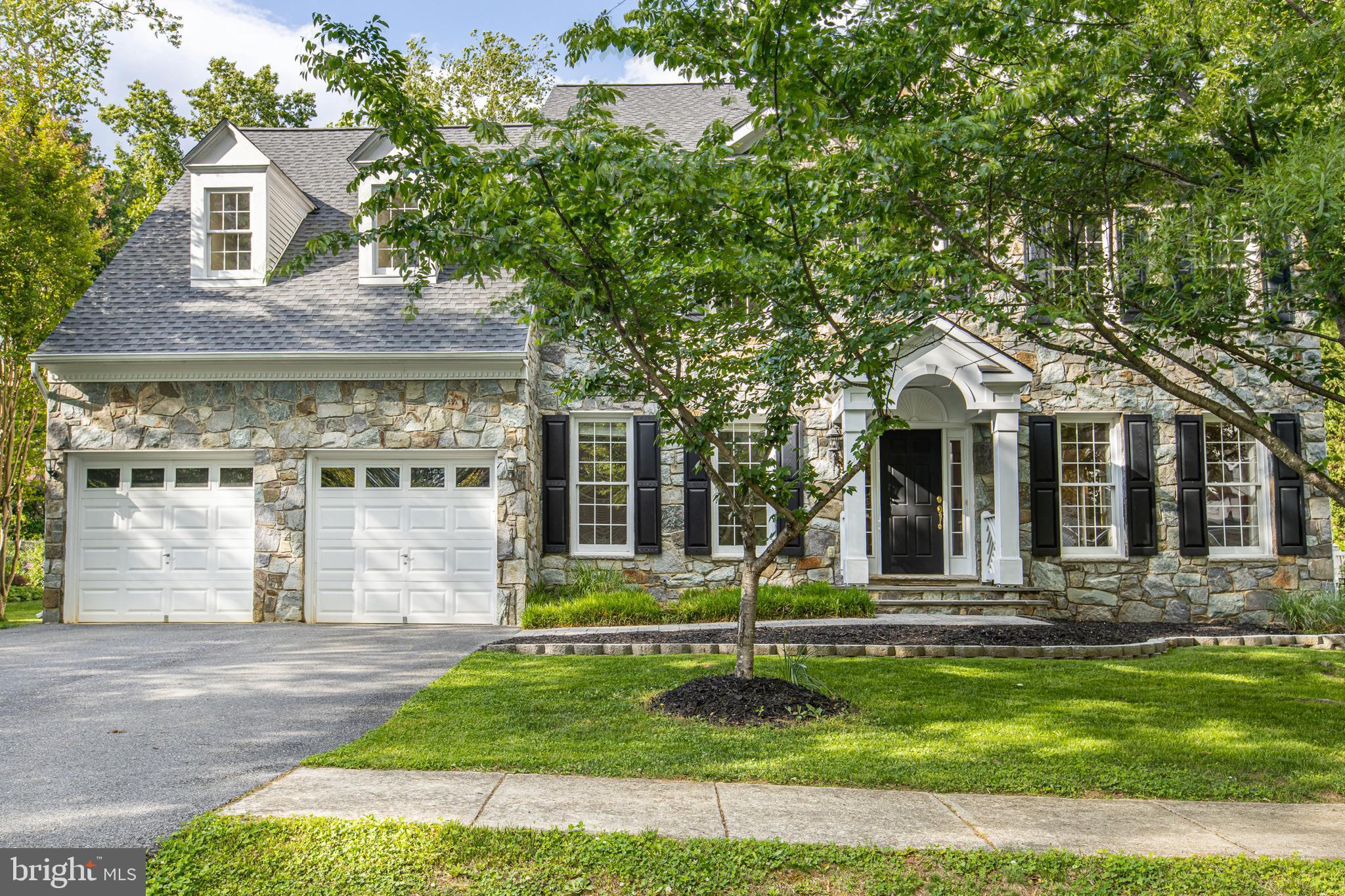 Welcome home to 2906 Boyds Cove Drive, a stunning stone-front Colonial nestled in the highly sought-after, upscale enclave of Boyds Ridge. This home offers over 3,800 square feet of elegant above-grade living space, perfectly blending sophisticated design with everyday comfort.

Step inside to an open flowing layout with gleaming hardwood floors, crown molding, and classic chair railings. The gourmet eat-in kitchen features granite countertops, cherry cabinetry, a gas cooktop, and a center island, flowing seamlessly into a breakfast nook and sunken family room anchored by a stone-front, wood burning fireplace, perfect for gathering with family and friends. A formal dining room rounds out the first floor, which also boasts an additional living room and library upon entrance to the house.

Upstairs, the luxurious primary suite serves as a true private retreat. It boasts soaring cathedral ceilings, a gas fireplace, and expansive his-and-hers walk-in closets. The en-suite spa bath features a relaxing soaking tub and double vanities. Three additional generously sized bedrooms complete the upper level.

The full walkout basement offers expansive unfinished space—a blank canvas ready to be transformed into a home theater, gym, or in-law suite. It already includes rough-in plumbing for a potential full bathroom, adding even more flexibility. Outside, enjoy a spacious rear deck overlooking a private lot, all tucked away on a quiet cul-de-sac.

Located just minutes from Historic Downtown Annapolis, the Parole town center, and major commuter routes, this home offers the ultimate combination of luxury, space, and convenience. Don't miss your opportunity to own in Boyds Cove!
