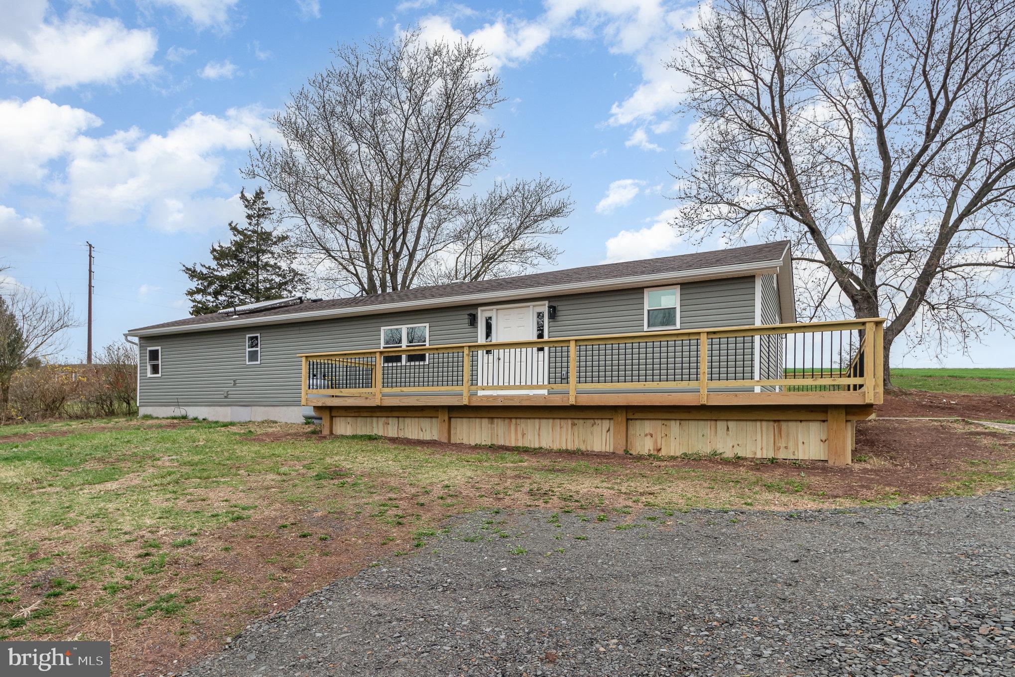 Welcome to this beautifully remodeled home, nestled in a serene country setting in Upper Paxton Township and located within the Millersburg Area School District.  Step inside to discover 1,680 square feet of thoughtfully finished living space, featuring all-new windows, plumbing, electric, attic insulation,  siding, drywall, flooring, recessed lighting and more. Updated kitchen complete with brand-new stainless steel appliances, and gas range. The layout has been enhanced with the addition of a full primary bath, creating a true primary suite retreat. As you enter, you’re greeted by a versatile mudroom/office space.  Convenient laundry area just off the bedrooms. The cozy living area is warmed by a propane fireplace, making it the perfect spot to unwind. Outside, you'll find a detached shed equipped with electric—perfect for use as a workshop, hobby space, or she shed. An upper attic area provides additional storage options, making it as functional as it is versatile. There’s even the potential for solar hot water (equipment is in place but currently not connected). "Enjoy the benefits of a larger lot, offering flexible outdoor space for entertaining, gardening, or relaxing. Don’t miss this move-in-ready gem with modern upgrades, generous outdoor space, and convenient access to local amenities!