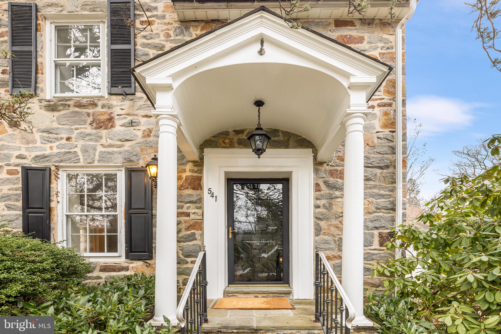 This classic 4 BD, 3 BA stone colonial is nestled in the heart of Strafford Village - one of the most popular neighborhoods in Wayne! With its timeless stone façade and traditional architectural details, this home exudes character and curb appeal. The generous floor plan offers gracious room sizes and ample space for both daily living and entertaining. First floor features include a large Living Room with wood-burning fireplace, sunny Dining Room with bay window, Kitchen with gas cooking and adj. Breakfast Room, large Mudroom, Laundry Room, and a main floor 3rd full BA.  You’ll love relaxing in the vaulted Family Room, which has a gas fireplace, loft, and built-in bookcases. Large windows invite abundant natural light, and there are hardwood floors in most rooms. Both the Kitchen and Laundry Room feature extensive storage in sturdy oak cabinets. Relax on the composite rear deck, overlooking the open  and level nearly 1/2 acre lot, which provides ample room for recreation and outdoor activities. 2nd floor features large Primary BD with 2 closets and en suite BA, 3 more Hall BD, and large Hall BA with double vanity and tub/shower combo. The walk-up 3rd floor Attic has several closets and offers great potential for adding a 5th BD suite or Office(s). Add’l storage is found in the partially-finished Lower Level which also has a large Rec Room with built-in bar. The corner lot location features two entrances. Visitors can park in the circular front driveway which leads to the main Entrance Hall, or on the garage side of the house, where there is another covered porch entrance. Located just moments away from shops and restaurants, top-ranked Tredyffrin-Easttown schools, and within walking distance of the train, this home offers a perfect opportunity for those looking to customize and update to their unique style and preferences. Don't miss this spacious home in a wonderful Main Line neighborhood!