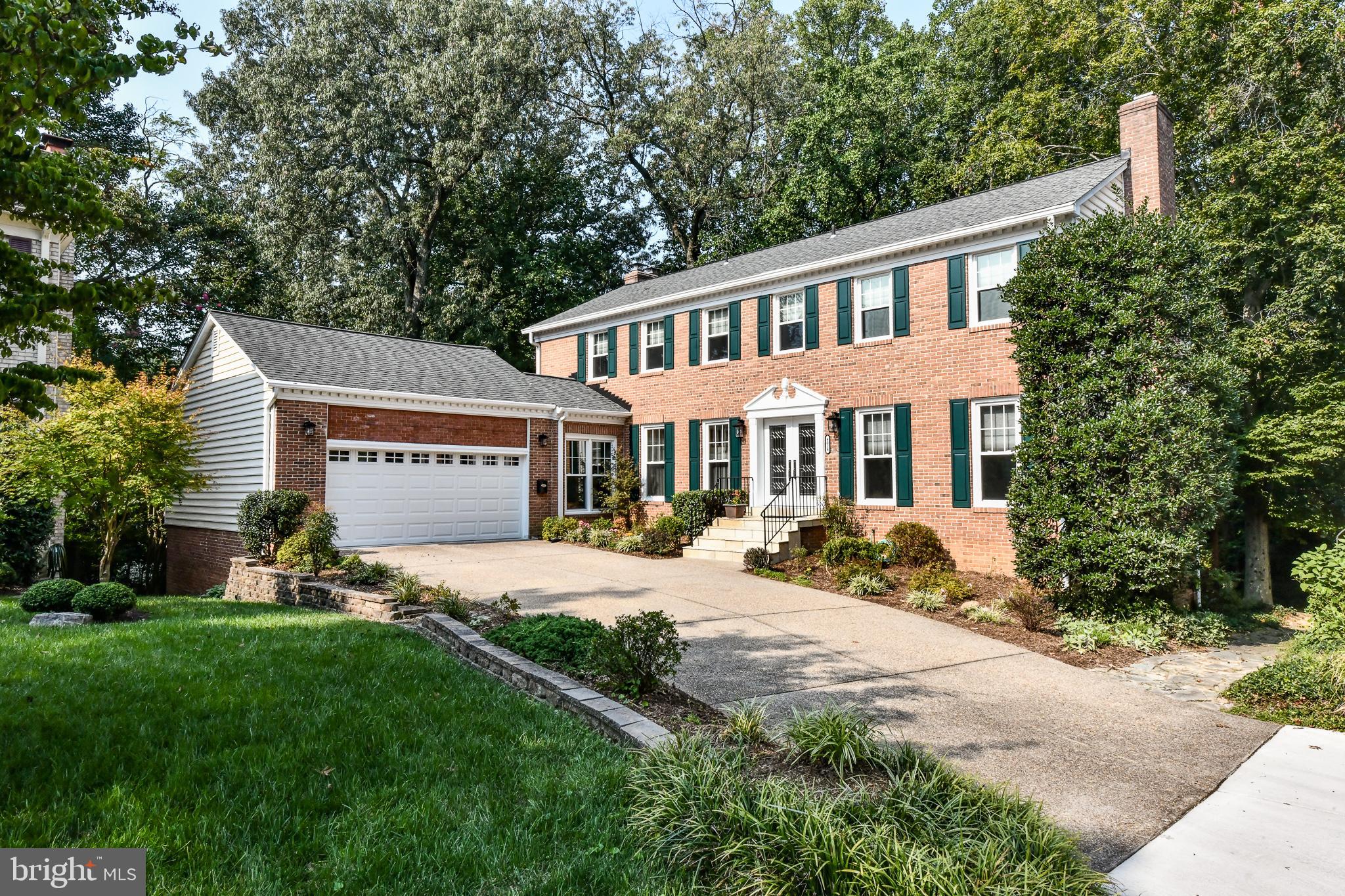 Gorgeous move-in ready colonial conveniently located in North Arlington!! This 6 bedroom, 4.5 bath colonial style home sits on one of the largest lots in sought after Black Oak Cluster. Set back off of the quiet tree-lined cul-de-sac, this home features a private and spacious side yard, slate patio and super-sized deck where you can comfortably relax. The professionally landscaped yard adjoins a wooded common area with original growth oak trees giving you both privacy and sanctuary. This child-friendly neighborhood is a short walk to Jamestown Elementary School and is in the Jamestown, Williamsburg, Yorktown pyramid. 
Lovely stone front steps and a new French glass entry door lead to a light-filled, porcelain tiled foyer with coat closet, and a main level open floor plan that offers the perfect flow for today’s lifestyle and entertaining. The main level has newly refinished hardwood floors.  
The spacious formal living room features crown molding, a wood-burning fireplace and a double set of French doors that open out to the deck. The adjacent formal dining room with chair rail and crown molding opens to the kitchen.
The eat-in kitchen has been completely updated and boasts granite countertops, a tiled backsplash, and brand new stainless steel appliances. The granite-topped island can easily seat 6 and provides additional storage. The kitchen area includes a large pantry, coat/storage closet and a built-in granite desktop. The kitchen adjoins the family room with its wood-burning fireplace, crown molding and double sliding glass doors that open out to the large deck. There is also a Florida/sunroom, which overlooks the slate patio and the beautifully landscaped yard.  The private super-sized back deck, with access from both the living room and family room, spans the entire length of the house, overlooking trees, as well as the home’s spacious side yard and adjoining common area.  Stairs from the deck lead to the slate patio and walkways.
The second level, with newly installed hardwood flooring, features the 18’ x 13’ master bedroom. The updated ensuite master bath has porcelain tile flooring, a large shower and a linen closet, along with his and hers mirrored dressing rooms with closets, shelving and separate vanities. There are four additional light-filled bedrooms on this level, all with abundant closet space, and two more newly updated baths, both with porcelain tile floors. There is a washer and dryer on this level.
The fully finished walk-out lower level has a view of the patio and yard and includes a large (19’ x 18’) recreation room with fireplace and wood-burning stove insert, a second kitchen, a laundry area with a full-size washer and dryer, a large bedroom (that could be divided into 2 bedrooms), an updated full bath, new flooring, and plenty of storage space with built-in shelving.  It’s a perfect space for an au pair or in-law suite! The lower level opens to a private covered sitting area with an 8-seat Caldera luxury hot tub and gives easy access to the large slate patio and professionally landscaped yard. 
The over-sized two car garage with its high ceiling, built-in shelves and cabinets, and built-in workbench provides plenty of storage and working space.
Freshly painted, this home has a new front entry door, new windows, two heat pumps, an attic fan, 6 ceiling fans, and hardwood floors on the first and second levels.
The location could not be better – 2 lights to Chain Bridge, easy access to DC, Pentagon, and major transportation arteries, minutes to Ballston, Clarendon and all Northern Virginia amenities.