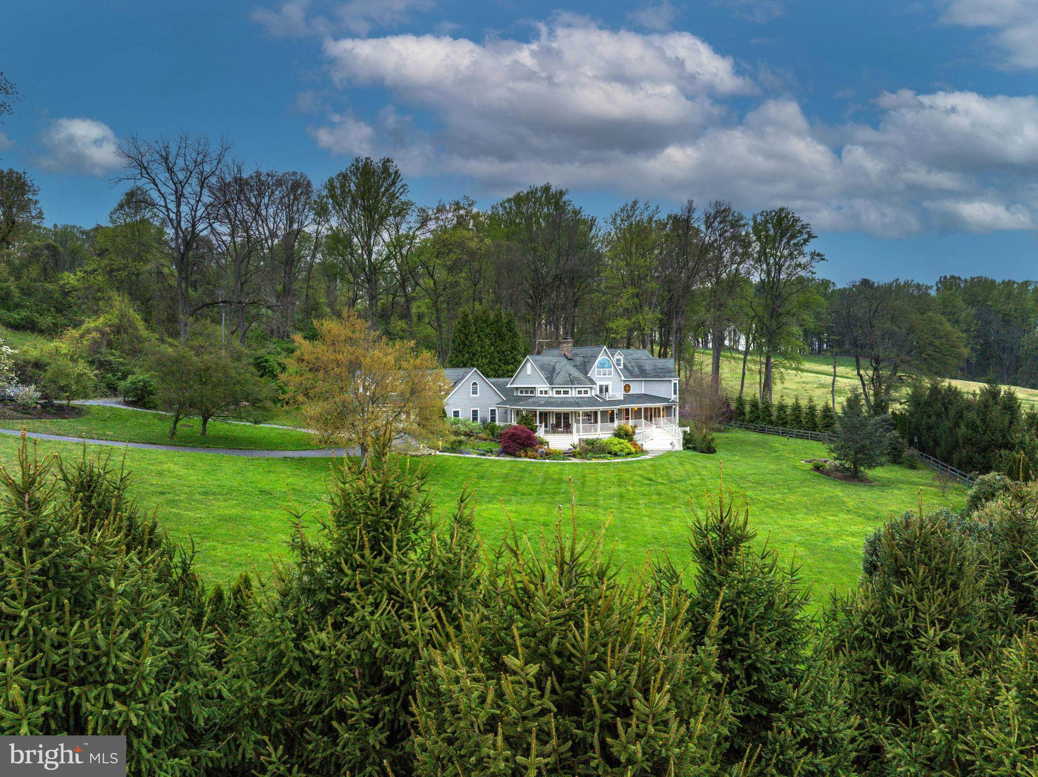 Live authentically. Nestled amidst the tranquil embrace of Worthington Valley, where whispers of history intertwine with the verdant tapestry of the land, stands a quintessential embodiment of southern living: the Farmhouse. A wrap-around porch that invites leisurely afternoons and convivial conversations.

As you traverse scenic Mantua Mill Road, a journey unfolds, painting a picturesque setting that stirs the soul and quickens the heart. Meander through the pastoral landscapes, punctuated by rolling hills and streams, bestow upon you a sense of serenity that transcends the confines of time.

Here, within the heart of this idyllic valley, resides a sanctuary where the hustle and bustle of the world recedes into the distance.  Proximity to all your desires remains within arm's reach, ensuring that convenience harmonizes seamlessly with seclusion.

Upon arriving at this haven of tranquility,  relish the cocoon of privacy.  The symphony of nature serenades your senses. The  glistening  pool beckons for a refreshing dip.

This farmhouse retreat has a welcoming open concept design that invites sunlight to cascade freely. A home infused with warmth and vitality. Gather, imbibe, and slumber in a space that is truly peaceful. 

As day fades into night and the stars cast their luminous gaze upon the landscape, surrender yourself to the embrace of country living. This home is a sanctuary for the soul.  Cultivate your existence. The art of uniting human and home.