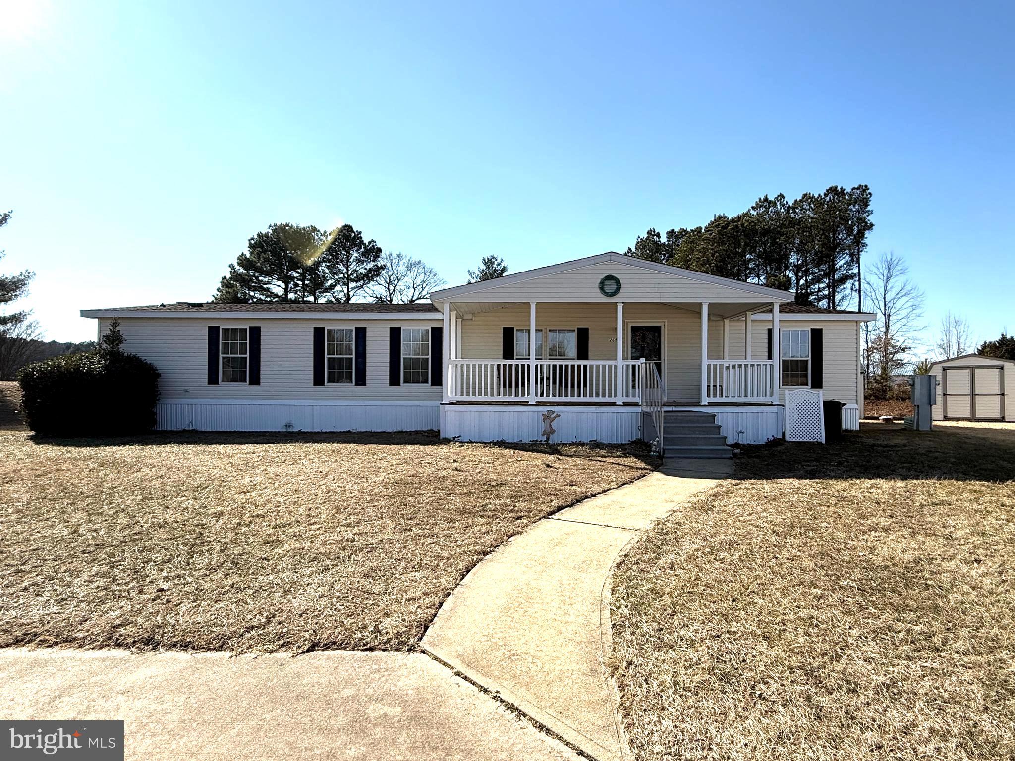 Welcome to this spacious 2002 Shultz manufactured home located in the desirable community of Hebron Woods. Offering 1,960 sq ft of comfortable living space, this well-maintained home features 4 bedrooms and 2 full bathrooms and sits on an extra-large, deep lot providing plenty of room to enjoy outdoor living.

Relax and unwind on the large covered front porch, or enjoy the open interior featuring a bright living area with an eat-in space and patio doors leading to the backyard. The home offers a functional layout with a separate laundry room, a spacious kitchen with abundant cabinetry, and charming built-in china cabinets. A dedicated TV room includes a built-in entertainment cabinet, adding both style and convenience.

The generous primary suite features a walk-in closet, full bath with soaking tub and separate shower stall, and an additional sitting area—perfect for a private retreat.

Additional highlights include a new roof installed in 2025 and a welcoming community setting. Residents of Hebron Woods enjoy well-lit streets, beautiful covered sitting areas at the entrance, and a community picnic area with catch-and-release fishing, creating a peaceful neighborhood atmosphere.

This home offers space, comfort, and community living all in one—schedule your showing today!