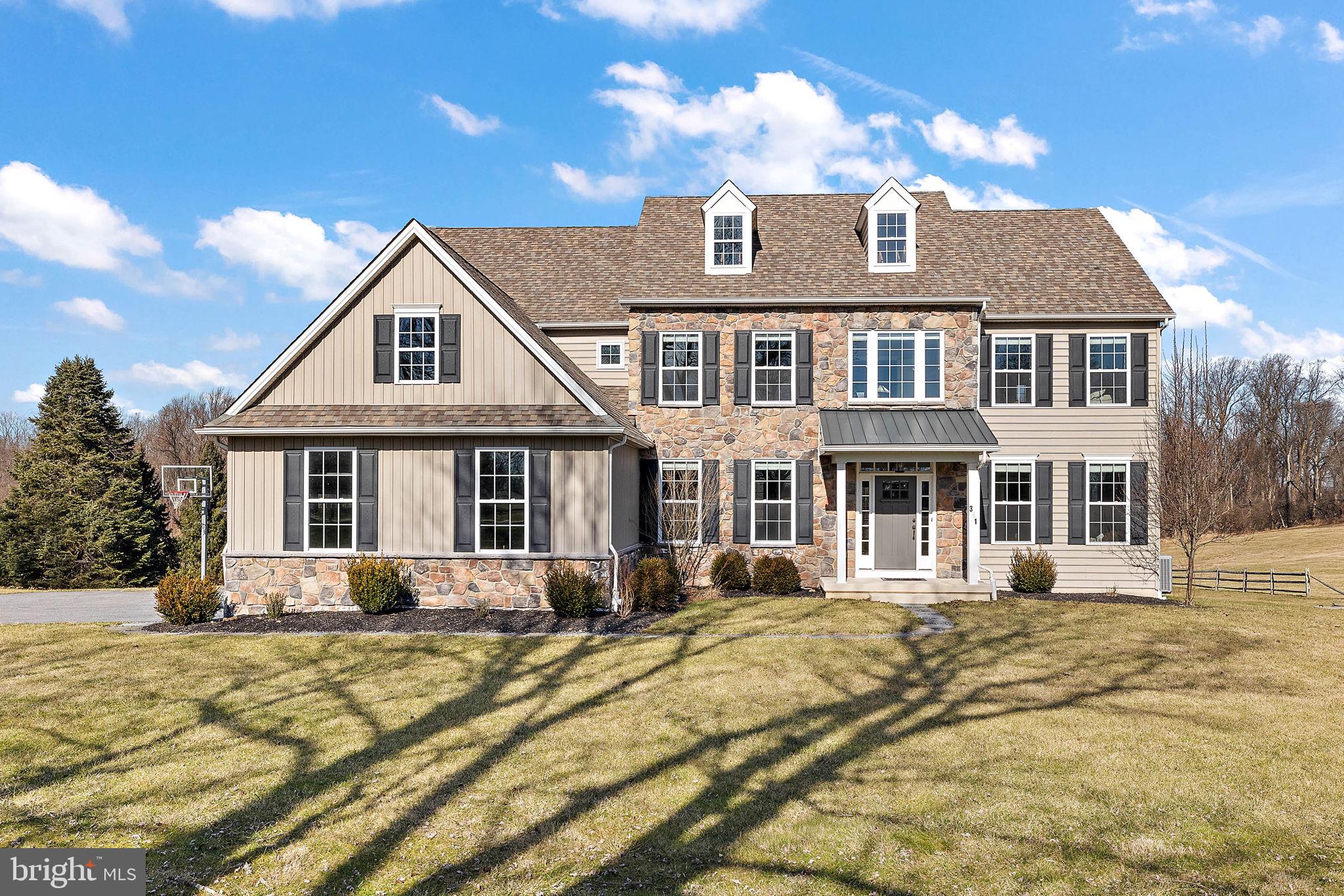 LIKE NEW CONSTRUCTION WITHOUT THE WAIT! Pictures might be worth 1000 words, but you have to experience this one in person to appreciate everything it has to offer! Shows like a model home full of luxurious upgrades and small details that make this 5000+ sqft. house feel like home. Situated on one of the most desired streets in Glen Mills, this custom-built home offers everything new construction has and MORE! Full of character and unique features, 341 Ivy Mills feels luxurious and grand, yet comfortable and homey. Traditional staples like formal living and dining areas make this transitional home the perfect combination of style and function.  MOVE RIGHT IN WITHOUT HAVING TO DO A THING!
On 4+ LEVEL ACRES, the property is as gorgeous as the home itself. Huge level yard of about 2.5 acres backs to woods, which are about an additional 1.5 acres of the 4+ acre property. Watch the foliage change color in the fall, enjoy the tranquility of the falling snow as it clings to branches in winter, and experience the colorful beauty of spring in bloom! Nothing will be built behind the home or on the preserved land across the street, so rest assured that your beautiful views of wildlife and sunsets are here to stay! FIRST FLOOR consists of engineered hardwood throughout, a grand see-through foyer, open staircase, formal living room, dining room with wainscoting (all complete with crown molding), and office with French doors. The kitchen has an oversized center island, quartz countertops, and large breakfast area that looks out onto the Trex deck and tranquil yard. With the adjacent family room complete with vaulted ceilings, plenty of windows, and a gas fireplace, the space lends itself to easy entertaining or a quiet night at home with close friends and family. Mudroom with built-in cubbies/hooks and additional side-entry door that leads to a spacious coat closet provide plenty of storage for family and guests. Powder room has an additional coat walk-in closet across the hall from it. SECOND FLOOR boasts a primary bedroom with tray ceiling AND sitting room. Master bath with MARBLE countertops, gorgeous and modern freestanding tub, rainfall shower, two walk-in closets, and linen closet. Second bedroom has its own private full bath. Two additional bedrooms, hall bath, and LAUNDRY ROOM with SINK complete the second level. Basement is FULLY FINISHED with an additional space for utilities and storage/workshop. With a wet bar/coffee bar, full bath, and plenty of light, this level feels like a private suite that holds endless possibilities! Whether you decide to use it as a game room, in-law suite, movie theater, home gym, or a combination of purposes, this space will be one of your favorites! Large windows and a slider that leads to the professionally hardscaped patio with gazebo and bar make this area ideal for entertaining and relaxing. Neutral stylish LVP flooring will hold up to the indoor/outdoor living and activity that this level offers. Minutes to Garnet Valley schools, grocery stores, restaurants, high-end shopping centers, spas, movie theaters and other entertainment. Major highways like Rt. 1, 95, and 476 are only a quick ride away. Or a five-minute drive allows you to catch the train into the city. All that while still being within minutes of playgrounds, parks, nature preserves, and trails!  All custom lighting fixtures and window treatments are INCLUDED, as is the basketball hoop and playset in the backyard. Any other furniture and personal property can be purchased/negotiated as an additional bill of sale. Make an appointment to see it or come to the OPEN HOUSE on 2/18 from 12-3pm. THIS ONE WON'T LAST!!