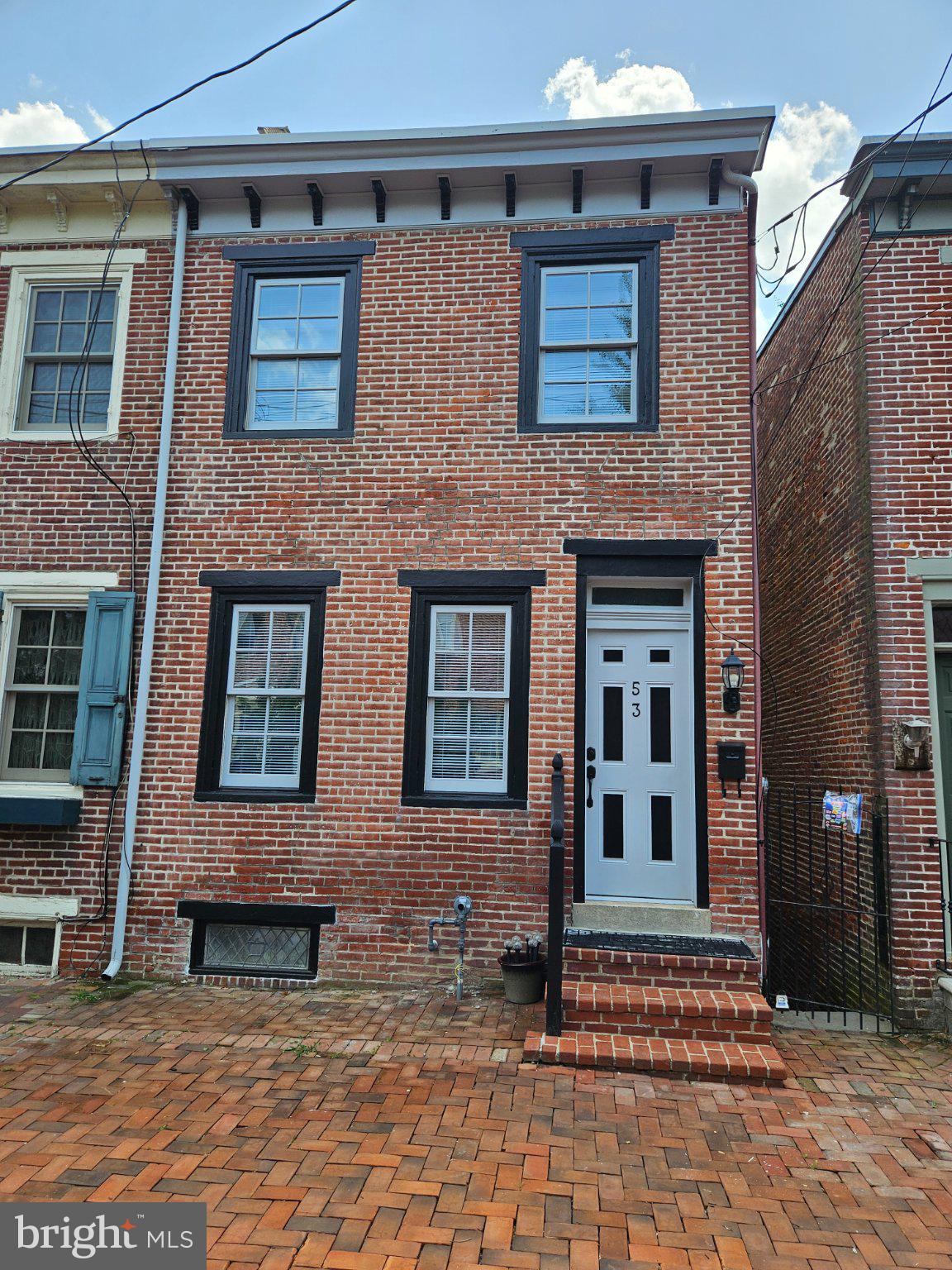Recently updated and move-in ready, this charming 2-bedroom home is located in the heart of the Historic District of Old New Castle. Blending timeless character with modern updates, this traditional three-level home offers comfortable living in one of Delaware's most desirable waterfront communities.

Recent improvements include durable 22-mil luxury vinyl plank flooring, new carpeting, fresh interior paint, a new roof, stainless steel appliances, and more.

The main level features a bright and inviting living room, a formal dining room, and an updated kitchen that opens to a spacious deck—perfect for relaxing or entertaining. Upstairs, you'll find two comfortable bedrooms and a full bathroom. The finished walk-out lower level offers a cozy family room with a fireplace and half a bath with direct access to the backyard, providing additional living space ideal for a media room, home office, or recreation area.

With Battery Park just behind the home, you'll enjoy easy access to scenic walking and biking trails along the Delaware River. Stroll into the historic downtown to explore charming restaurants, shops, museums, and year-round community events. This home offers the perfect combination of modern updates, historic charm, and an unbeatable location.

Don't miss this opportunity to own a beautifully updated home in the heart of Historic Old New Castle!
seller is a real estate licensed agent in Delaware