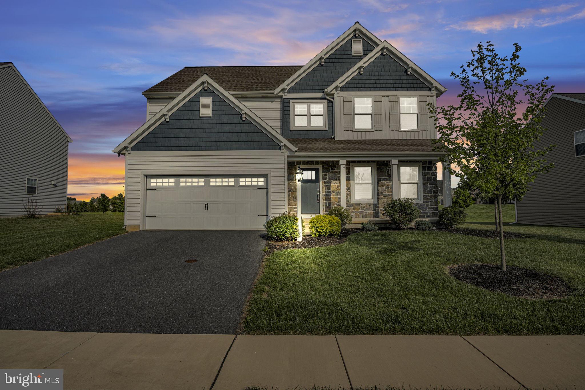Welcome to 14 Danbury Drive in the sought after Danbury Glen community, located within the Cumberland Valley School District. This former Garman Builders model home showcases exceptional craftsmanship and thoughtful upgrades throughout, offering both style and functionality. Featuring 4 spacious bedrooms and 2.5 bathrooms, this home is designed for modern living. A private, designated office provides the perfect space for working from home or quiet study. The gourmet kitchen is a true centerpiece, complete with quartz countertops, a tile backsplash, stainless steel appliances, a farmhouse sink, and a large center island ideal for seating and entertaining. The open floor plan flows into the family room with streaming natural light and the warmth of the modern fireplace. Elegant shiplap and wainscotting accents add character throughout the home, while hardwood flooring flows seamlessly through the foyer, powder room, kitchen, family room, and mudroom. The primary suite offers a relaxing retreat with a tray ceiling, walk in closet, and a luxurious en-suite bath featuring a floor to ceiling tiled walk-in shower. Three additional generously sized bedrooms and the convenience of a second-floor laundry room. Step outside to enjoy the deck overlooking a peaceful green space, perfect for relaxing or entertaining. With its prime location, high end finishes, and like new condition, this home is truly move in ready and a must see.
