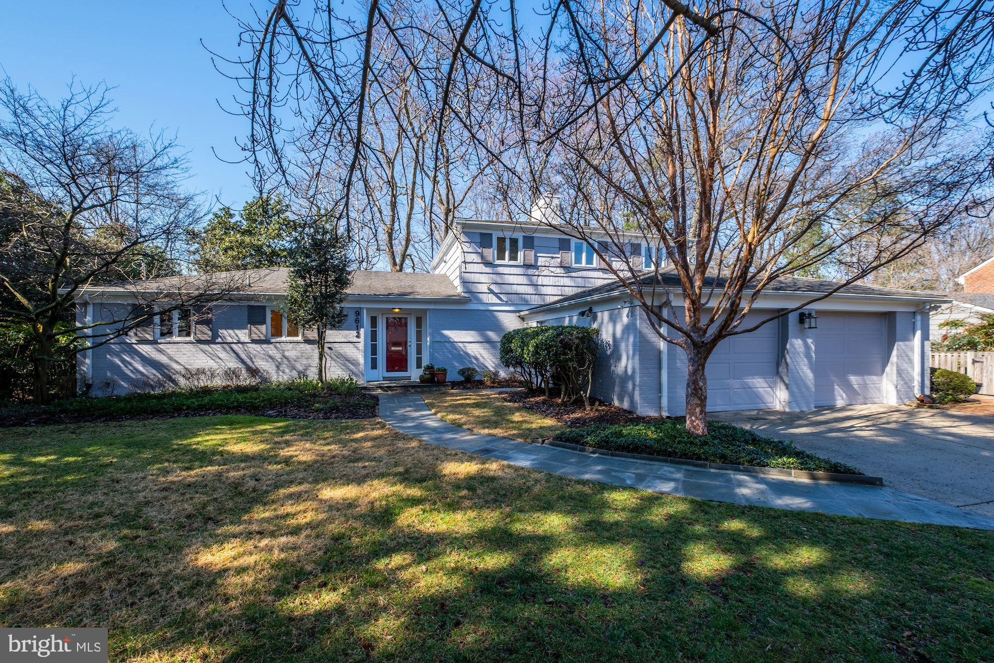 A very special offering in Rock Creek Hills. Tucked back off the street on a .43-acre lot adorned with specimen trees and flowering shrubs, this move-in ready home offers wonderfully versatile space suited to any life stage. An abundance of windows permit ample natural light which accentuates the golden hardwood floors. Affording picturesque views from nearly every room, main level highlights include an owner's bedroom suite with a renovated bath, a large living room with built-ins and a fireplace, a phenomenal family/great room with coved cathedral ceiling and walls of glass, a separate central dining room, a beautifully renovated custom kitchen with delightful breakfast area featuring vaulted ceiling and skylights, an office/additional bedroom, a renovated powder room, and a laundry room. On the upper level are two spacious, private bedrooms with two closets each, a full hall bathroom with a vanity desk, and a walk-in storage closet​. The large lower level offers open recreation and game rooms, the second fireplace, a side entrance to a bedroom suite which features a renovated bathroom, a walk-in closet, and an adjacent sitting room/office, and a utility room for additional storage and function. Outside, the magnificent grounds consist of a private rear yard with child's play-set, lovely brick patios, and stone walkways and accent walls. A generator, an oversized 2-car garage, and an attached storage shed complete the exterior amenities. Just off Kensington Parkway near Rock Creek, in the Bethesda-Chevy Chase school district, and moments to downtown Kensington's shops, restaurants, and the train station, this location has it all. Welcome to your forever home!