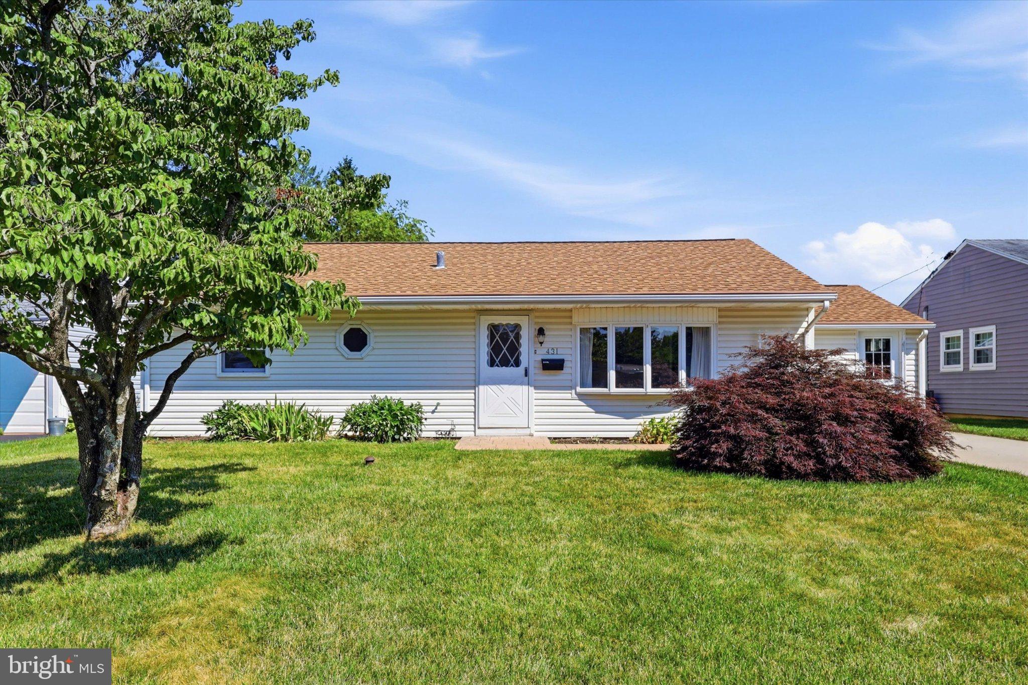 Welcome home to this beautifully maintained 3-bedroom, 2-bath ranch offering the perfect combination of comfortable one-floor living, gracious interiors, and everyday convenience in the highly regarded Pennsbury School District. From the moment you arrive, you'll appreciate the home's inviting curb appeal, expansive front lawn, and pride of ownership that is evident throughout. Step inside to discover a light-filled living room that creates a warm and welcoming atmosphere for both relaxing and entertaining. Crown molding adds an elegant finishing touch to the dining area, while the thoughtfully designed layout provides an effortless flow throughout the home. The heart of the home is the kitchen, featuring Corian countertops, abundant cabinetry, and a functional peninsula offering additional workspace and casual seating. The kitchen transitions seamlessly into the dining area, creating an inviting space for everyday meals and memorable gatherings. Sliding glass doors lead to the bright enclosed sunroom, creating the perfect place to enjoy your morning coffee, unwind with a good book, or entertain while overlooking the backyard. The private primary suite serves as a peaceful retreat, complete with its own ensuite bathroom featuring a walk-in shower. Two additional generously sized bedrooms are served by a well-appointed full hall bathroom, providing comfortable accommodations for family members or guests. Step outside to enjoy a backyard with plenty of space for gardening, pets, play, or simply relaxing outdoors. A large storage shed offers excellent room for lawn equipment, tools, and seasonal items, while the converted garage/carport provides exceptional storage rarely found in homes of this size. Ideally situated directly across from an elementary school and just minutes from shopping, dining, parks, and major commuter routes, this home combines everyday convenience with a desirable location. Even better, all township Use & Occupancy certifications have already been completed, offering buyers added peace of mind and helping streamline the path to closing. Whether you're purchasing your first home, downsizing to the ease of one-floor living, or simply searching for a move-in-ready home in a sought-after school district, this charming ranch presents an exceptional opportunity to make it your own.
