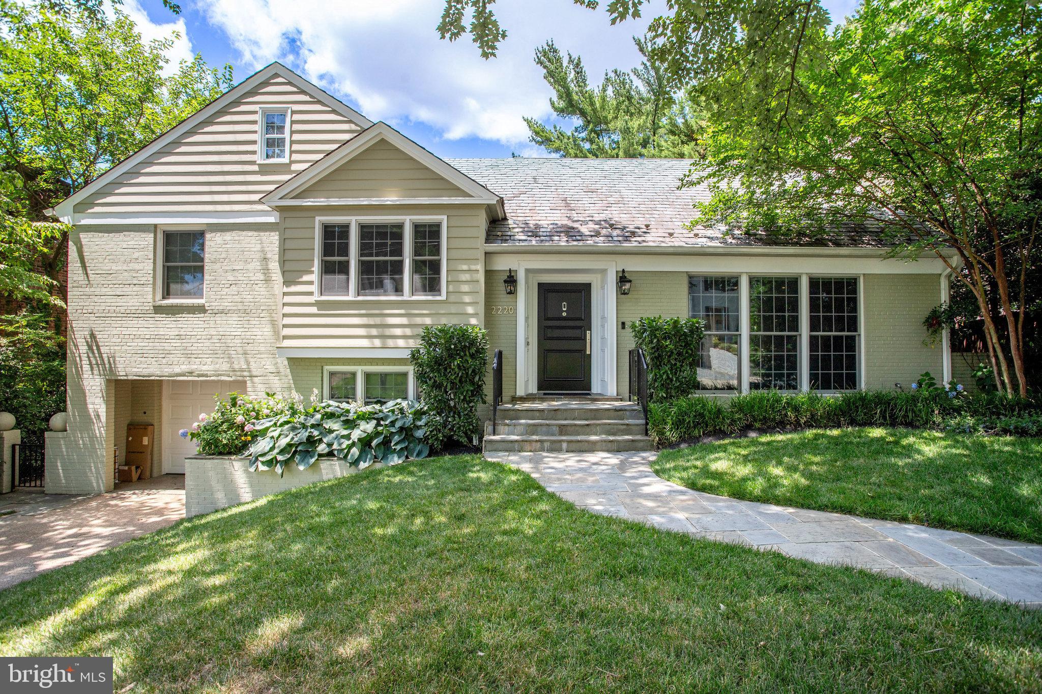 This stunning renovation represents an optimal blend of contemporary living and timeless charm.  Built in 1952, this property has been transformed to an open space with horizontal lines,  walls of windows while maintaining a functional flow.  Located on a quiet street in Berkley, this home has been completely renovated with exceedingly high quality modern fixtures and finishes.  Comprising approximately 4,000 square feet, this five bedroom, four and one-half bathroom property offers generous living space on the main level, creating an ideal flow for entertaining between indoors and outdoors.  Upon entering, one experiences an inviting foyer open to a large living room with floor to ceilings windows, affording superb natural light.  A fireplace with an elegant stone mantle creates a warm and inviting ambiance.  The expanded kitchen features a waterfall island, Dekton counters and backsplash, Scavollini cabinetry, a custom bar, wine fridge, and high-end appliances.  The family room is open to the kitchen, creating a perfect environment for entertaining.  Sliding glass doors open to the private deck, providing a sense of tranquility.  French doors open onto the lower-level slate patio which overlooks a thoughtfully landscaped yard with mature trees and flowers.  A few steps lead you to the second level with spacious bedrooms and spa-like bathrooms.  The primary bedroom offers a sitting area, and the primary bath renovation was inspired by those found in luxury hotels.  Storage is provided by a sizeable walk-in closet.  Step down from the foyer to a sitting area, centered between the home office and the breathtaking patio, for your outdoor escape.  The home office may be used as a bedroom if additional space is required.  The basement offers a huge recreation room with three large window wells, suitable for family entertaining or a home theater.  Another bedroom with a separate entrance and full bathroom are also found on the lower level.  All windows and sliding doors are Anderson Architect Series and LED recessed lighting has been integrated throughout the property.  Located in a beautiful neighborhood between Spring Valley and the Palisades, this residence is within minutes to parks, schools, shops and fine restaurants.