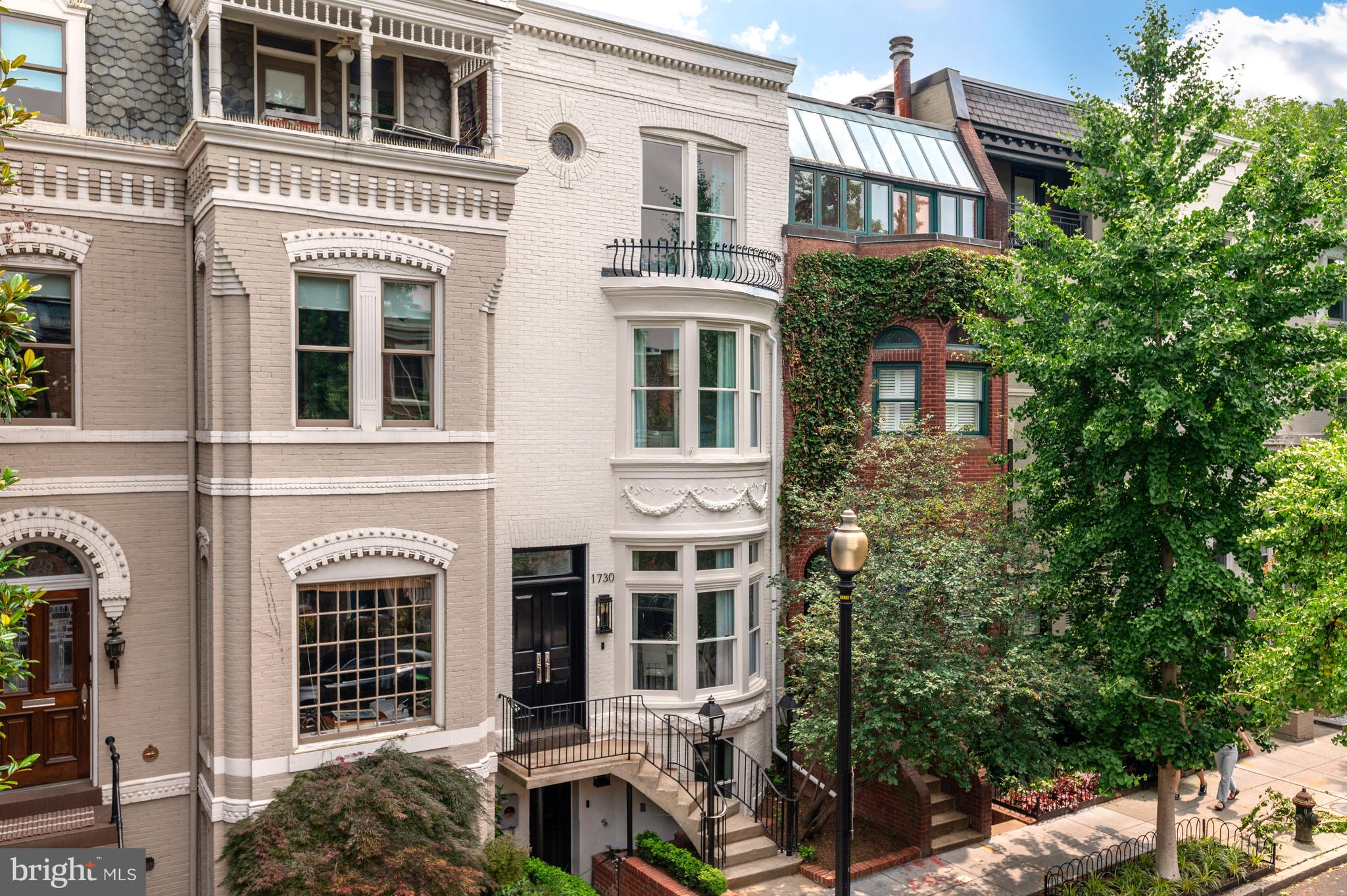 Exquisitely reimagined by Akseizer Residential, this impeccably appointed Victorian townhouse showcases a new level of grandeur in DC’s Dupont Circle neighborhood. Meticulously renovated to the highest of standards and utilizing designer fixtures and finishes, this sprawling 4 Bedroom, 3.5 Bathroom residence boasts unparalleled luxury living across 4 fully finished levels and 3,150 total square feet. Originally built in 1885, this Akseizer masterpiece has undergone a complete historic renovation to deliver a breathtaking property that honors the architectural integrity of the home’s original design while seamlessly integrating the coveted luxuries of a discerning modern lifestyle. Inside, elegant moldings, timeless trim and herringbone hardwood floors are complemented by soaring ceilings and abundant natural light. Outside, privacy abounds with a fully fenced rear patio that lends an idyllic setting for al fresco dining with a built-in BBQ Grill and ample space for entertaining. An urban convenience sure to delight any city dweller, this residence provides 2 private, off-street parking spaces.