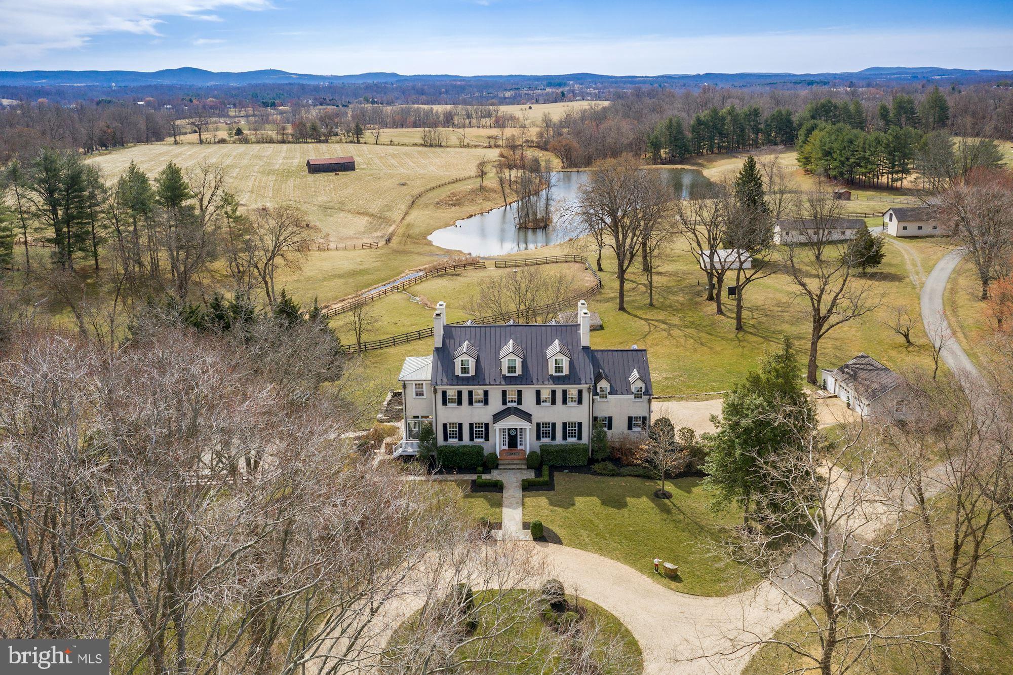 Mortgage Hall is situated in the heart of hunt country minutes from historic Middleburg. The 121-acre estate boasts a Georgian Mansion built in 1850 that currently operates as a destination event venue and horse farm. With scenic views of the countryside and Bull Run Mountains the “manor house” is the perfect venue or family home featuring 9 bedrooms (accommodating up to 20 guests), 5.5 bathrooms, a large eat-in kitchen with a sitting area, formal dining room, living room with wood-burning fireplace, library and WiFi throughout. Some of the many stunning features of the home are the grand ceilings, 6 wood-burning fireplaces, and restored hardwood floors. Relax and unwind with your guests on the large stone patio or fishing by the pond. The working farm offers 3 barns (6, 6, and 24 stalls), multiple fenced paddocks with auto-waterers and run-ins, 2 workshops, a chicken coup, and a tenant house. This grand retreat awaits you! Extensive updates have been made since 2019. Conservation Easement. See documents.