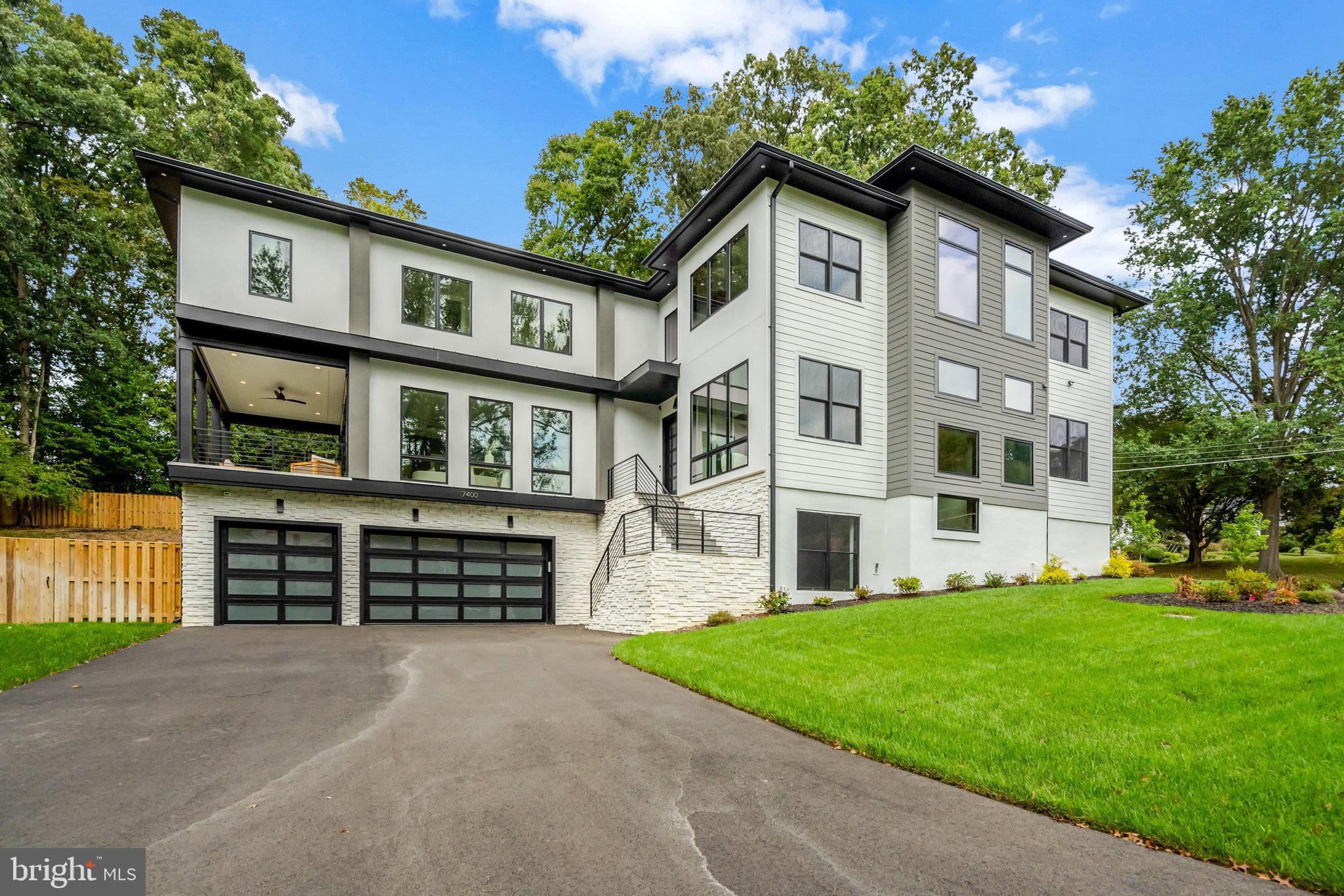 Step into this extraordinary prairie-style residence—where modern elegance, timeless architecture, and thoughtful design meet—nestled in one of McLean’s most coveted neighborhoods.Offering over 7,450 square feet of beautifully finished living space, a BUILT-IN DUMBWAITER TO TRANSPORT YOUR GROCERIES, and a PRE-FRAMED ELEVATOR SHAFT for future installation,  this home features 6 spacious bedrooms, 6 full spa-inspired bathrooms, 2 stylish powder rooms, and a 3-car garage. EV-ready and meticulously crafted, it’s a showcase of sophistication and functionality. Premium Pella Lifestyle black windows and a sunlit walk-up basement further elevate its appeal.A grand two-story foyer welcomes you inside, where soaring ceilings and natural light highlight the rich solid oak hardwood floors. The formal  room and elegant dining area provide the perfect backdrop for both intimate gatherings and large-scale entertaining.At the heart of the home, the gourmet kitchen is a chef’s dream—complete with professional-grade Thermador stainless steel appliances, a generous walk-in pantry, and seamless flow into the inviting family lounge. A striking full-height tiled fireplace wall serves as a bold and beautiful focal point.Step outside to a rear covered porch with duradek decking at covered balcony and porches, and a retractable motorized MagnaTrack screen for year-round enjoyment.Upstairs, retreat to the luxurious owner’s suite, offering a private balcony, a custom walk-in closet, and a spa-inspired bathroom with a deep soaking tub, frameless glass shower, and elegant TOTO fixtures. Three additional en-suite bedrooms provide comfort, light, and plenty of space for family and guests.
The fully finished lower level is an entertainer’s dream—complete with a sleek wet bar and wine storage, an exercise room, a pre-wired 7.2.4 surround sound media room, and a private guest suite with full bath.Practicality meets style in the thoughtfully designed mudroom, featuring a built-in bench, cubbies, and a dedicated dog wash station, all tailored for today’s lifestyle.Dumbwaiter from the garage to the main level to transport groceries. Garage includes a modern insulated tempered full-glass black garage door with keypad access.Refined yet comfortable, dramatic yet practical—this stunning home is designed for the modern family who values beauty, space, and intentional design in every detail.
**Designed and built by Green Valley Custom Builders - 2024 & 2025 NVBIA Award Winner for Best Design and Architecture in the $3M - $5M Category! ** Green Valley Custom Builders, a family-owned luxury home builder, has been proudly serving Northern Virginia since 2013. Renowned for creating inspired living spaces, they seamlessly integrate modern design with an indoor - outdoor lifestyle concept, exceptional craftsmanship, and sustainable practices. Each home showcases open floor plans, soaring ceilings, and expansive windows - features thoughtfully designed to elevate everyday living while balancing beauty and functionality. What truly sets Green Valley apart is their commitment to genuine hospitality. More than providing exceptional service, they deliver a seamless building experience and lasting support for homeowners well beyond move-in.
