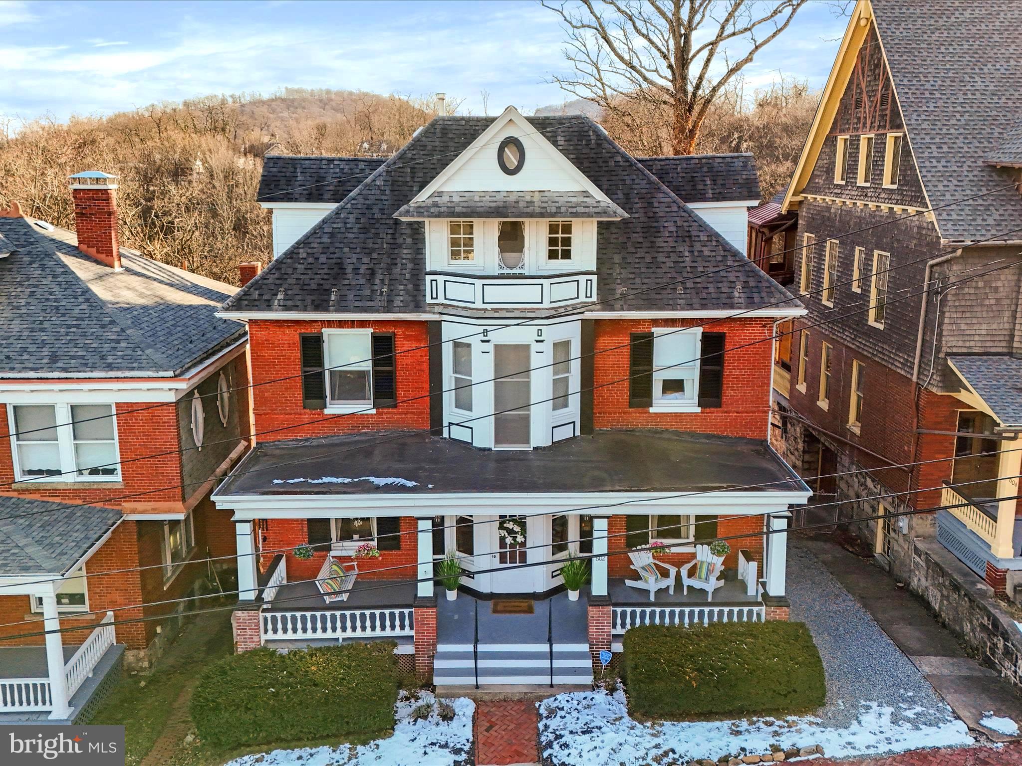Stunning and charming is 602  Washington Street in the Historic District, built in 1890! This property is full of character and boasting of original wood trim with its blend of historic character and modern upgrades as it offers the best of both worlds. Located just steps from local shops, restaurants, and cultural attractions, 602 Washington Street is a rare gem in the heart of the historic district. Four levels finished which includes 5 bedrooms, 2 full baths, 2 half baths,  walk out basement to a peaceful patio/deck for relaxing evenings and endless enteraining.  A rare find, whether you're relaxing on the front porch, entertaining in the backyard, or enjoying the expansive living spaces inside, this Victorian beauty is sure to impress. Don't miss the opportunity to own a piece of history with all the comforts of today! The home also boasts a sunroom off the kitchen, off-street parking for one vehicle, and additional features that appeal to buyers looking for charm and history.
