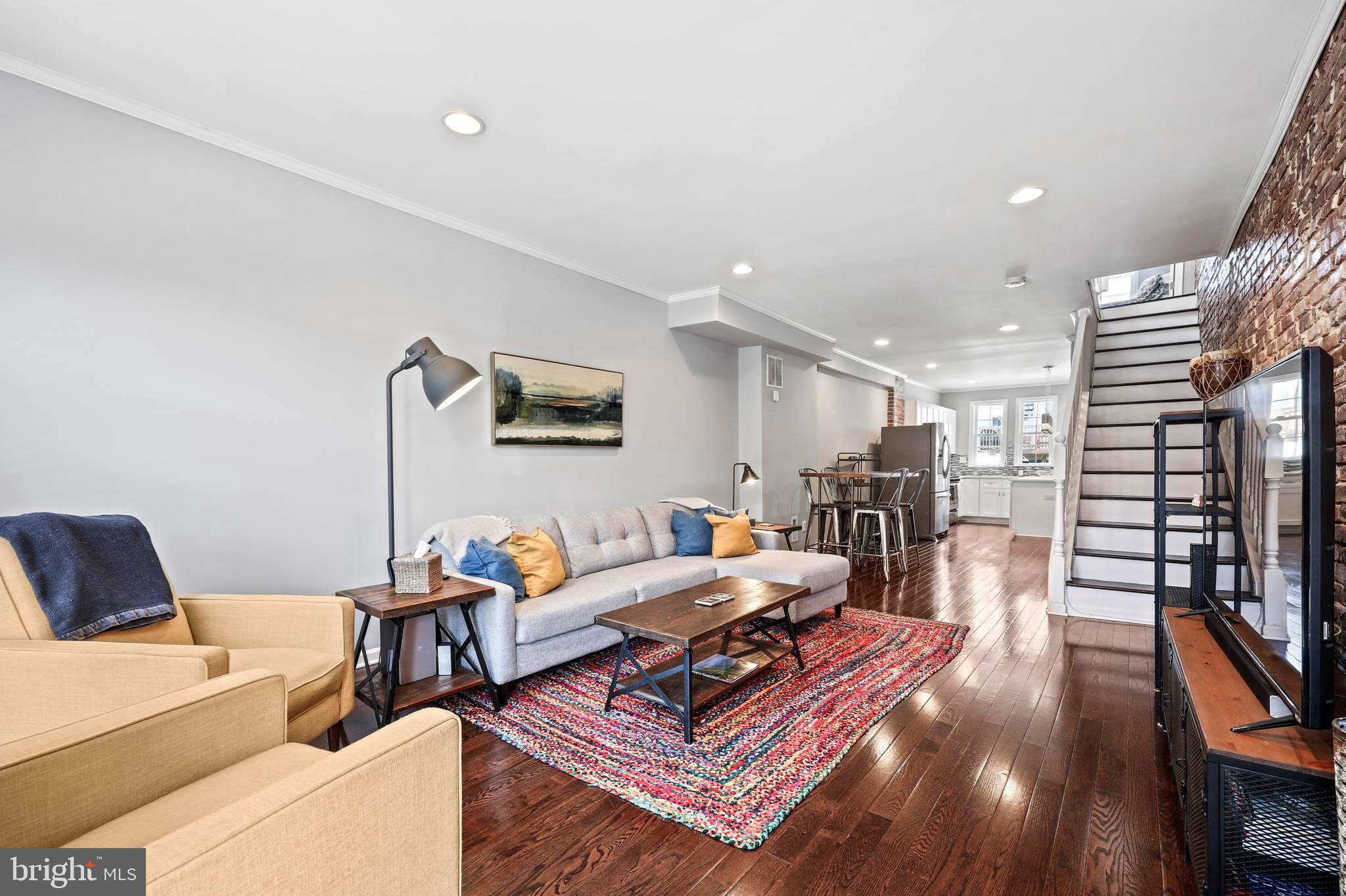 ***MULTIPLE OFFERS RECEIVED - SELLERS ARE REQUESTING BEST AND FINAL BY 9PM ON SATURDAY, 4/12. THANK YOU!*** Welcome to 259 S. East Avenue, a beautifully updated 13 ft. wide brickfront rowhome on one of the most coveted blocks of Patterson Park! With 3 bedrooms, 3 full bathrooms, and a thoughtful blend of modern updates and classic charm, this home offers spacious living, high-end finishes, and incredible functionality. Step inside to gleaming hardwood floors, exposed brick, recessed lighting, and a neutral palate ready for your personal touches. The modern kitchen is a chef’s dream, featuring white shaker-style cabinets, granite countertops, stainless steel appliances, and a large island with bar seating—perfect for entertaining. Upstairs, you’ll find two generously sized bedrooms, including a primary suite with an en-suite bath. The fully finished basement provides additional living space and features a versatile third bedroom with a built-in Murphy bed, making it ideal for guests, a home office, or a workout space. Outside, enjoy a spacious patio perfect for relaxing or entertaining, plus the convenience of a private parking pad. Most recent updates include: washer/dryer (2018); ceiling fan in primary bedroom (2018); sump pump (2019); roof resurfaced (2019); primary bathroom reconfigured to add dual vanity and new barn door entry (2019); front storm door (2019); cornice replaced (2023); flooring on basement steps (2024); new hardwood flooring throughout main level (2024); new LVP flooring in basement (2024); new paint on main level, basement, and primary bedroom (2024). And the location? Perfectly situated just 2 blocks from Patterson Park with easy access to green spaces, walking trails, and the famous "pagoda", short distance from Creative Alliance, and close proximity to some of the best restaurants and shopping that Baltimore City has to offer. The sellers are sad to leave this amazing community of neighbors...seasonal block parties/celebrations, community "yard" sales, charming string lights...they even have their own Facebook group for the 200-400 blocks of S. East Ave! Don’t miss this incredible opportunity to be the "new kids on the block" —schedule your showing today!