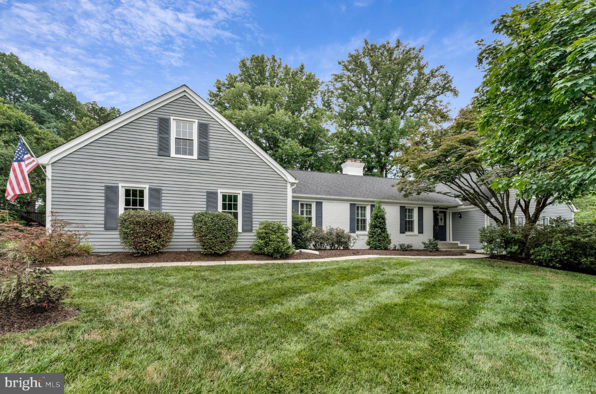 In the sought after community of Colvins Glen and the Langley HS Pyramid, this exquisite Cape Cod residence, expanded and remodeled with over 4000 sq. ft. of living space, offers a harmonious blend of luxury and comfort. Spanning over 5 spacious bedrooms, 3 full baths and 2 half baths, this home is designed for both relaxation and entertaining. The centerpiece of the home is the expansive family room/great room with cathedral ceiling, built in bookcases, dry bar, and gas fireplace a perfect space for hosting friends and family.  The gourmet kitchen is a chef's dream, featuring a large island, double ovens, and a cozy breakfast area, perfect for casual dining. Adjacent to the kitchen is the mudroom with half bath, main level laundry room, large closet, and built-ins, a perfect drop zone entering the home. The formal dining room sets the stage for memorable gatherings, while the formal living room with vaulted ceiling and wood-burning fireplace adds to the warmth of the home.
Ensuring its privacy, 4 steps down from the main level, the primary bedroom has its own personal deck, en-suite updated bathroom, and walk in closets. This level also has 2 other sun filled bedrooms and an updated hall bath. The upper level has 2 delightful additional bedrooms with an updated hall bath. The lower level features a custom bar with brass details, game room space, and half bath.  In addition, a large media/ playroom with built-ins is perfect for movie night. The large unfinished, storage and utility room complete the lower level. 
Outside, the professionally landscaped lot backs to tranquil trees, providing a private oasis. Enjoy the fully fenced backyard with lovely screened gazebo and the spacious composite deck. Thoughtfully designed landscape lighting enhances the property with a captivating nighttime atmosphere.
Close to major commuting routes, national and local parks, world class shopping, 
Dulles Airport, and the Silver Line Metro stations. An idyllic place to call home! 
Schools: Colvin Run/Cooper/Langley