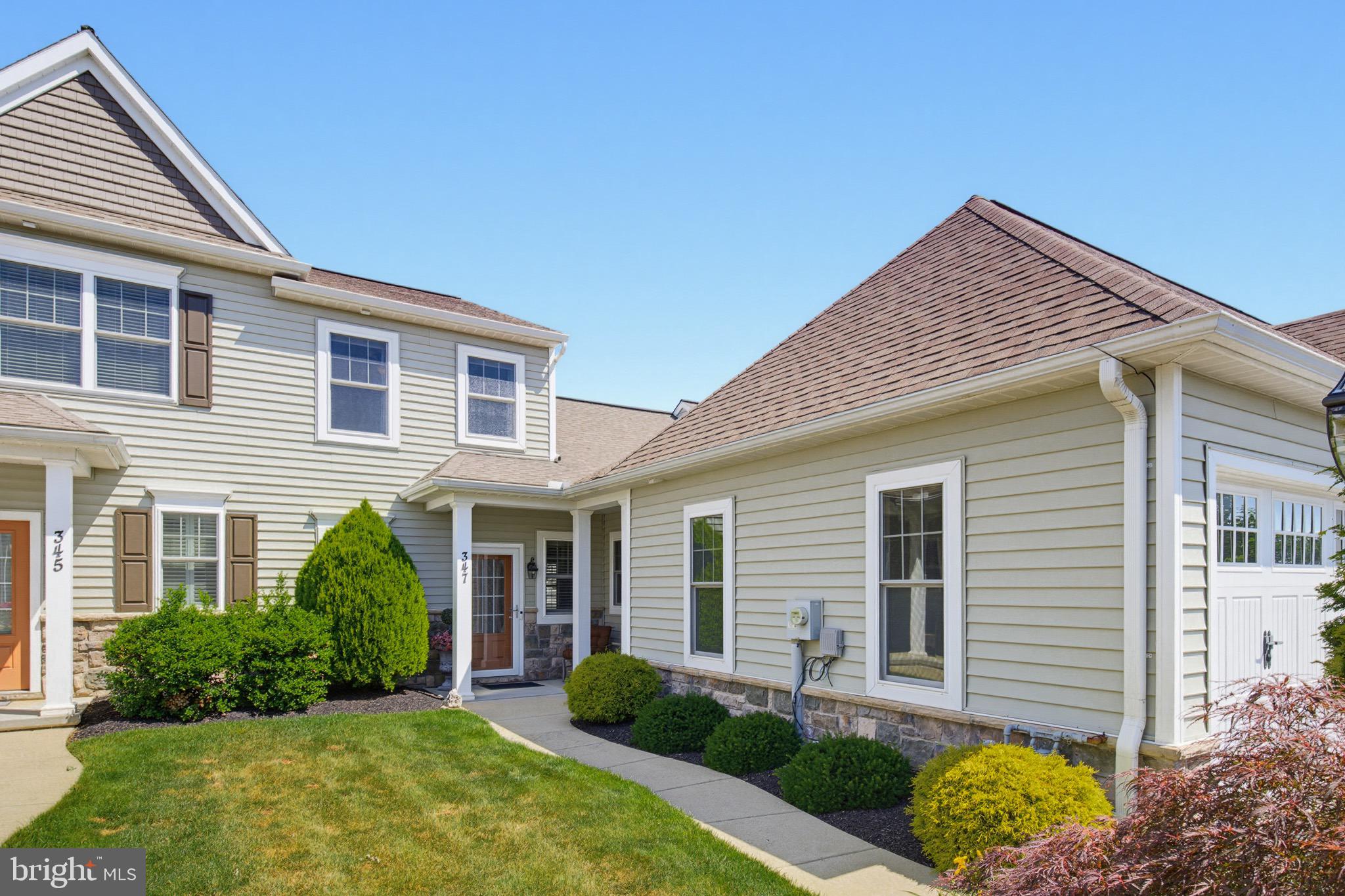 Welcome to 347 English Ivy Drive in Lititz, PA, an exceptional EG Stoltzfus Bedford II townhome where luxury, comfort, and thoughtful upgrades come together in one of Lititz’s most desirable communities. Offering 3 bedrooms, 2.5 baths, a first-floor primary suite, sunroom, and two-car garage, this home has been extensively enhanced far beyond builder specifications. The stunning kitchen features GE Café Series appliances, Italian Statue quartz countertops, a quartz double-bowl sink, custom tile backsplash, and upgraded fixtures. Throughout the home, you'll find premium flooring replacing all builder-grade materials, custom built-in shelving, plantation shutters, upgraded lighting and ceiling fans, smart home technology, and beautifully reimagined stairways with hardwood treads, iron spindles, and designer finishes. The luxurious primary bath has been completely transformed with a custom full-tile shower, porcelain tile flooring, upscale fixtures, and a custom California Closets system in the spacious walk-in closet. Additional bathroom upgrades provide comfort and accessibility. Major mechanical improvements include a Navien tankless water heater with recirculation loop, active radon mitigation system, smart thermostat, security system, smart garage access, and ongoing professional HVAC maintenance. Outside, professionally designed landscaping, colorful specimen plantings, and mature Blue Spruce trees create privacy and year-round curb appeal. Meticulously maintained and loaded with high-end improvements, this move-in-ready home offers a rare opportunity to enjoy luxury, convenience, and low-maintenance living in the heart of Lititz - located just a short walk to the Lititz Public Library and connected to scenic neighborhood walking trails, this home combines low-maintenance luxury living with one of Lititz’s most desirable locations in the town famously named America’s Coolest Small Town.