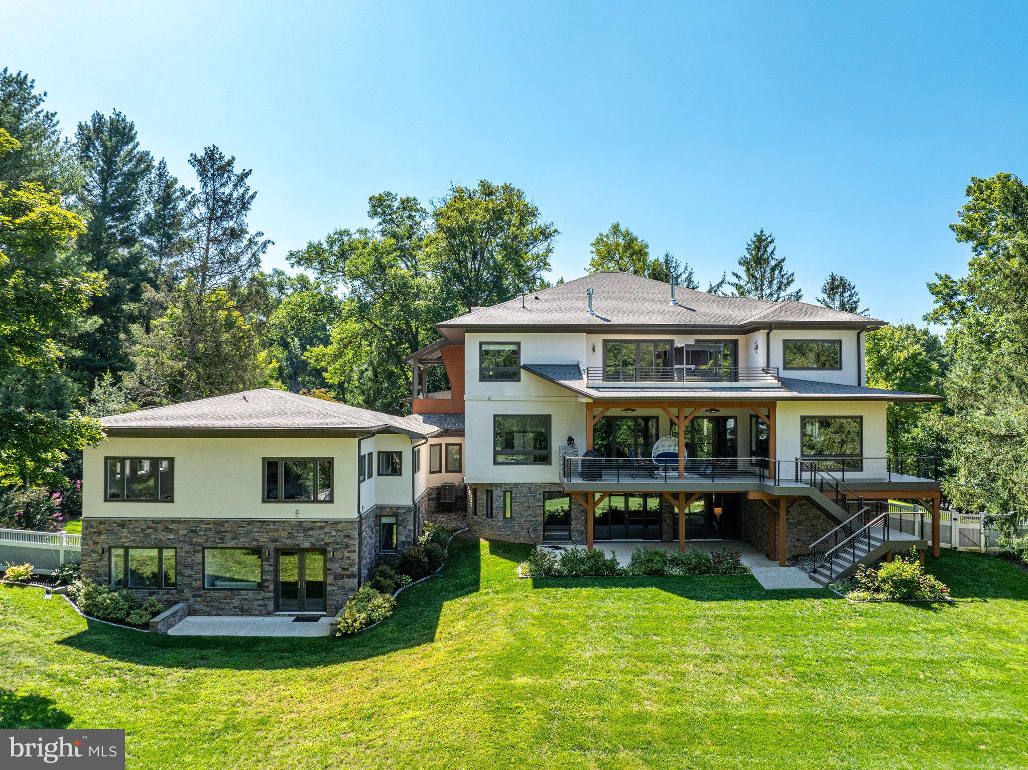 Welcome to 9604 Pembroke Place in Vienna, VA! This stunning property offers a modern and luxurious living experience. The main house boast 5 bedrooms, 5 full bathrooms and 2 half bathrooms ,  an elevator in addition to a separate fully loaded 1 bedroom apartment-like  guest suite with living room, and spacious kitchen. The house was built in 2020, ensuring that you will enjoy the latest in design and construction. The property boasts a generous living space of approximately 9700  square feet, providing ample room for entertaining friends and family. The spacious bedrooms offer a comfortable retreat, and the bathrooms are thoughtfully designed with high-end fixtures. The home features 10-foot ceilings on the main level and 9-foot ceilings on both the upper and lower levels, with numerous windows flooding the spaces with natural light. The chef's kitchen is equipped with high-end appliances, including Wolf double ovens, a microwave, a 48" gas cooktop with 6 burners and a griddle, a Sub-Zero refrigerator, and a Wolf built-in coffee system, making it a culinary enthusiast's dream. The kitchen also features an 8-foot-long island with a waterfall quartz counter. In addition to the main house, the property features two attached —providing space for 6 cars. Beautiful outdoor living spaces further enhance the home's allure, providing the perfect setting for relaxation and entertainment. Located in the desirable locality of Vienna, this home offers convenience, accessibility to Tysons and ensures you are well-connected to the surrounding area. This property is 10 minutes from Tyson's, Reston, Vienna and Great Falls. Whether you need to commute to work or explore the vibrant neighborhood, everything is within reach.  Don't miss the opportunity to make this luxurious dream home your own. Contact us today to schedule a viewing and experience the best in modern living.