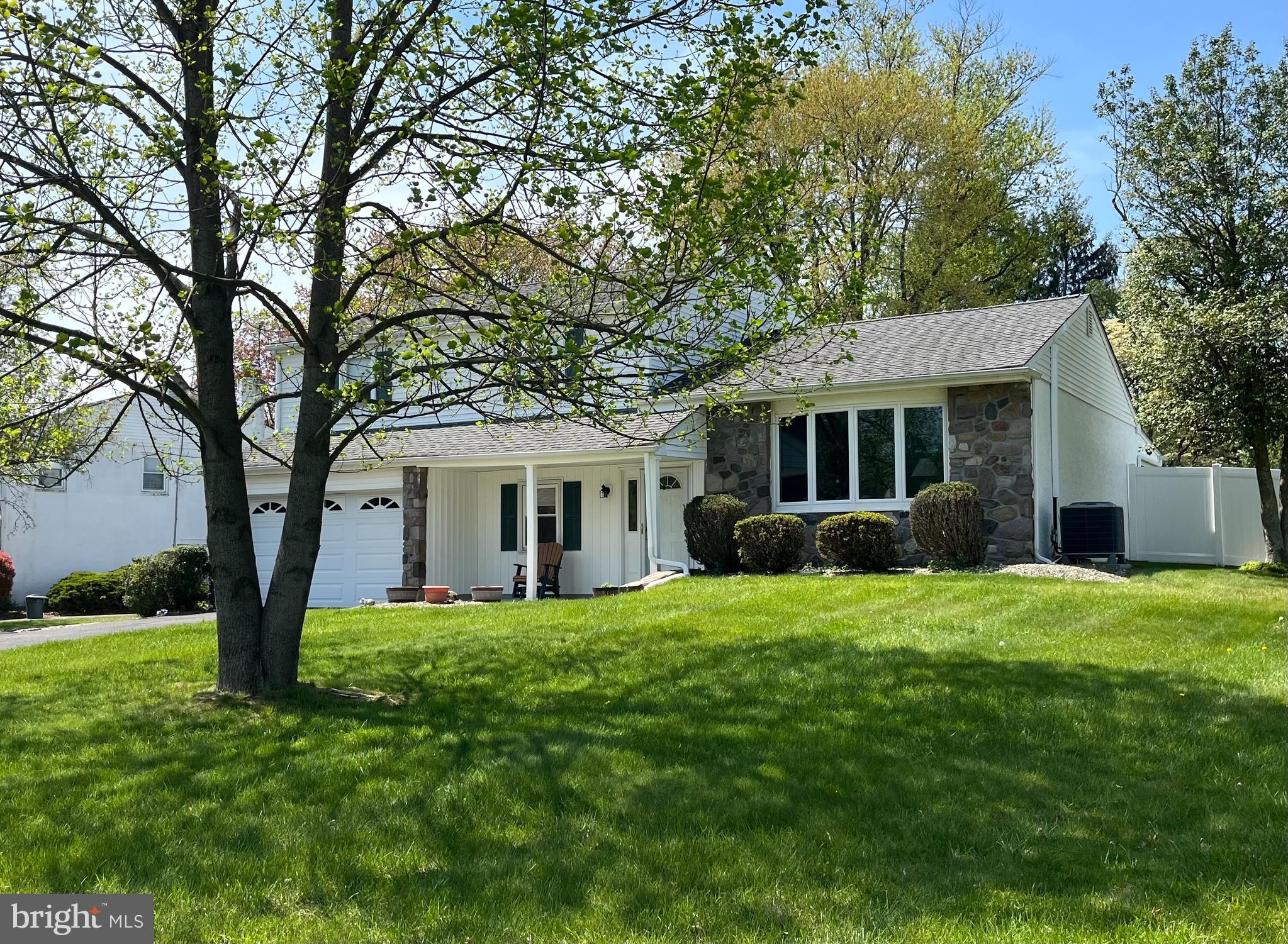 Welcome to this beautifully maintained 3-bedroom, 2.5-bath split-level home nestled on a half-acre lot in one of Bucks County’s sought-after neighborhoods. Located within the Council Rock School District, this home offers the perfect blend of comfort, space, and timeless charm.  Built in 1962 and only the second time on the market, this home includes a 1.5-car garage and has been lovingly cared for by its owners.  Step inside to find hardwood flooring throughout, an inviting living room that offers a pretty view of the front yard through the bow window, a separate dining room, and an eat-in kitchen featuring a double wall oven—perfect for everyday meals and entertaining.  Step out onto a sunroom off the back of the house complete with a hot tub, creating the ideal space for year-round relaxation.  The 1st level offers a family room off of the kitchen with a wood-burning fireplace and a great natural lot, a laundry room and a powder room.  Enjoy outdoor living with a patio right off the family room, and a backyard offering privacy, a storage shed, and ample space for gardening or play.  The bedrooms and two full baths make up the 3rd floor, including a primary en suite.  The partially finished basement and walk-up attic provide plenty of storage and flexibility, or additional living space.  Don’t miss the opportunity to make this special property your own!