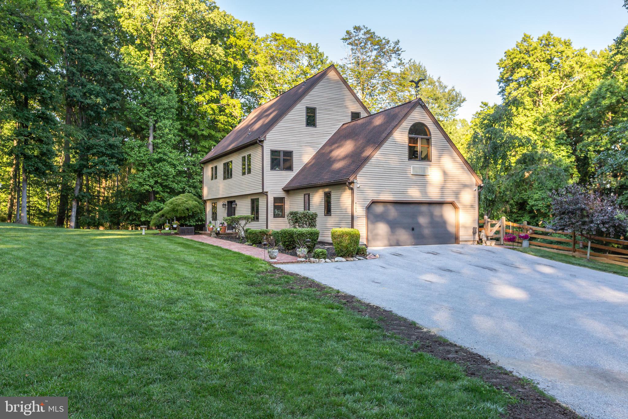 Welcome to 4105 Edges Mill Road, a stunning 6 bedroom, 3 and a half bathroom home set on 3.5 bucolic acres in sought-after Downingtown. Beautifully designed with plenty of natural wood details and stylishly decorated according to today’s trends, this home is ready for you to move right in. An added bonus, the 2-story detached garage is ideal for a contractor or car enthusiast.  The second floor of the detached garage is finished offering plenty of space for an expanded home office or an au-pair or in-law suite! An excellent location, Downingtown is known for its stellar accessibility, plenty of popular bars, restaurants, and shopping options, and, of course, several gorgeous parks and trails.

As you approach the home, you’ll appreciate the long driveway, transporting you to a wooded, private haven. Enter the home and be greeted by an airy and light atmosphere– a result of the open floor plan, wood details, and plenty of natural light. The kitchen features a center island with barstools for casual dining, and opens to a sunny breakfast nook framed by a floor-to-ceiling fireplace. The living and dining rooms flow well into one another, creating a breezy atmosphere while retaining each room’s own functions. The true gem of the home is the sunroom featuring skylights and looking out onto the expansive, covered rear deck. This is the perfect place to unwind in nature, all year round! Upstairs you’ll find the spacious primary bedroom boasting an overlook to the sunroom, walk-in closet, and spacious en suite bathroom. Two other bedrooms, an office, home gym,  and a hallway full bathroom complete the second floor. On the third floor you’ll find 3 additional bedrooms and a third full bathroom, so you’ll have more than enough room for a hobby space or home office! An unfinished basement functions perfectly for storage, or, finish it and create additional living space. Head outside and enjoy a lovely, landscaped backyard lined with trees which preserve the privacy and beauty of your land. 

Situated less than 3 miles from the Borough of Downingtown, there are endless options for shopping, dining, and fun all within your reach at 4105 Edges Mill Road. Enjoy the beauty of nearby parks including Marsh Creek State Park and Dowlin Forge, and access to Downingtown’s Struble Trail, which connects these parks with The Ponds Park in Downingtown Borough. Commuters can take advantage of nearby major highways including the 30 Bypass, Route 100, and Route 202, as well as Downingtown Train Station, with access to the Paoli Thorndale Line (connecting you to the Main Line and Center City Philadelphia), and Amtrak (connecting you to New York City and Harrisburg). Come by and learn about all that 4105 Edges Mill Road has to offer!