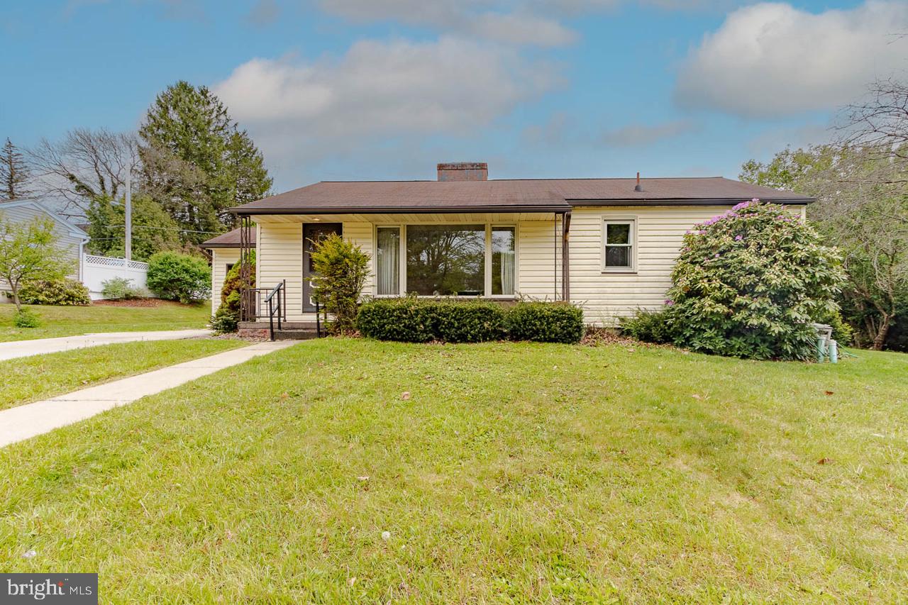 Welcome to 304 Curtis Street, a 3-bedroom, 1 full bathroom ranch-style home offering classic charm, functional updates, and standout mid-century details throughout. The home features a one-car attached garage, central heating and cooling, and a rear patio ideal for outdoor entertaining. Inside, the main living area showcases large front windows, warm wood trim, a fireplace, and vintage character that carries throughout the home. The dining area is highlighted by beautifully built-in cabinetry, while the kitchen offers granite countertops, LVP flooring, and convenient access to the rear patio. Original details include glass door knobs and hardwood floors believed to be preserved beneath the existing carpet. The full bathroom is a true statement space with original tile, a cast iron tub, and timeless vintage character. The basement adds even more flexibility with a finished retro entertaining area and an additional "Pittsburgh-styled" bathroom. With solid bones, original charm, HVAC, garage parking, and an inviting indoor/outdoor living space, this Philipsburg ranch offers a rare opportunity to enjoy, personalize, or restore a home with real character.