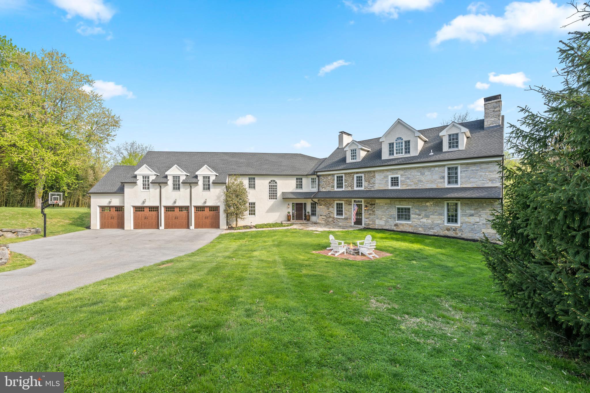 Poised at the end of a picturesque, tree-lined lane, 1660 Hidden Way offers a rare opportunity to own a home where timeless character and modern living exist in perfect harmony—set within the highly sought-after Tredyffrin-Easttown School District. The original section of the home dates to the 1760's with an addition in the 1800's. The newer wing nearly doubled the size of the home in 2008.  From the moment you arrive, you’ll appreciate the home’s history and architectural details—rich hardwood floors, original millwork, numerous fireplaces, and beautifully exposed original stone walls featured throughout multiple rooms, reflecting exceptional craftsmanship and enduring quality. These historic elements are seamlessly complemented by expansive, light-filled living spaces designed for both everyday comfort and effortless entertaining. This impressive residence features 5 spacious Bedrooms, 4 full Baths, 2 half Baths, a finished walk out Lower Level and a 4 car Garage. First Floor includes a 2 story Great Room, Kitchen with Breakfast Room, Fireside Dining Room, Den with a wood buring fireplace, original Living Room showcasing 2 fireplaces, a screened-in porch, a full Bathroom and a Powder Room. Two separate staircases lead one upstairs to discover the impressive Primary Suite with renovated Bath and oversized walk in closets, Laundry Room, Office, 3 additional Bedrooms (2 with exposed stone walls) and 2 full Bathrooms. The Third Floor offers the 5th spacious Bedroom which could also make a wonderful playroom or private bonus space. The Lower Level features generous finished space with a half bath. windows, a walk out doorway and considerable unfinished storage space. Set on over 7 breathtaking acres, the property showcases gorgeous, panoramic views in every direction. A lovely, meandering stream with a  pond add to the storybook setting and enhances the natural beauty that surrounds the home. The sparkling pool provides the perfect centerpiece for summer relaxation and entertaining while the adjacent stone fireplace takes the chill off during the cooler evenings. A charming red barn, once home to horses, currently serves as terrific outdoor storage. Blending old-world charm with modern space and amenities, this exceptional property delivers a lifestyle of comfort, elegance, and tranquility.  With terrific proximity to wonderful shopping, dining, the Paoli Amtrak train, rt 202, other major arteries and the Phila Int'l Airport, commuting is a breeze from this ideal location. 1660 Hidden Way is more than a home—it’s a unique and remarkable retreat. Schedule your tour today!