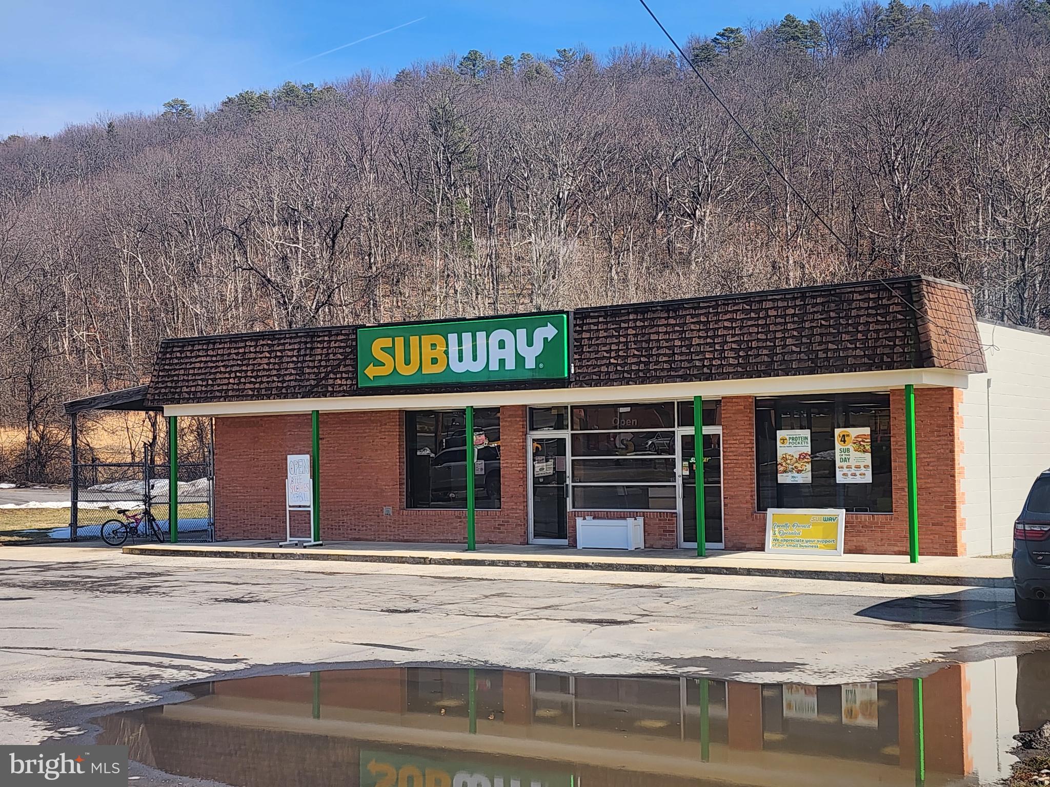 High-traffic commercial opportunity with established business history! This prime property offers exceptional visibility and a long-standing community presence.  The building has been recently remodeled, is situated on over 1/2 acre, and features an additional unit currently leased as a café/coffee shop, offering built-in rental income. Continue the current setup ( with an additional purchase of the Subway franchise), or take advantage of this highly desirable business location for your own concept. Whether you're an experienced entrepreneur or considering business ownership for the first time, this well-established location offers the perfect place to start or expand.