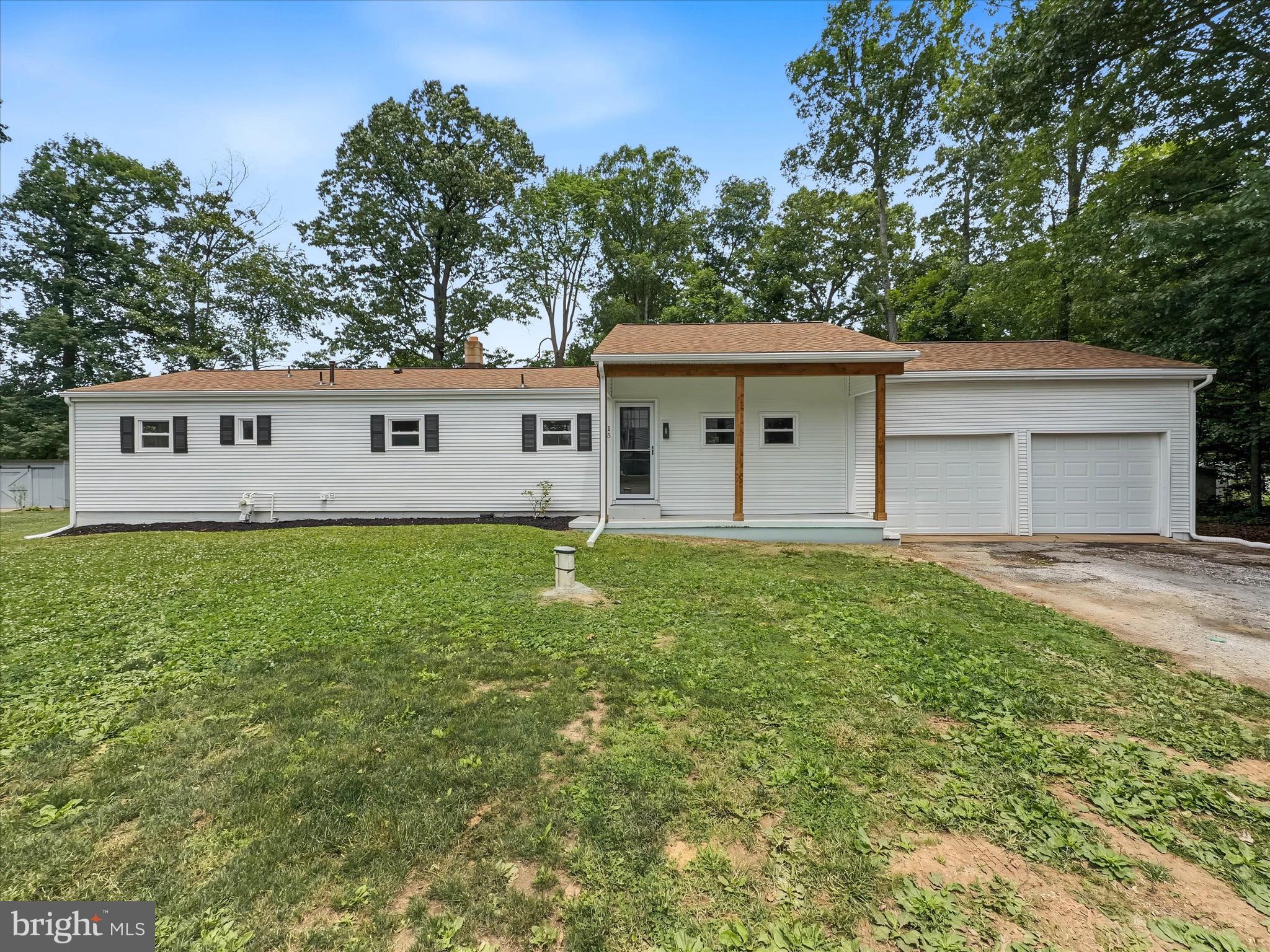 COMPLETELY REFRESHED and ready to impress! Welcome to 15 Foundry Avenue, where classic ranch-style living meets modern updates on over a half-acre in highly desirable Southern York County, just minutes from the Pennsylvania/Maryland line. From the moment you step inside, you'll appreciate the thoughtful transformation throughout. The beautifully renovated kitchen is the heart of the home, featuring gorgeous quartz countertops, brand-new stainless steel appliances, abundant cabinetry, a peninsula with seating, and a separate eat-in dining area, making it the perfect space for everything from busy weekday mornings to holiday gatherings. The sunken living room creates a warm and inviting atmosphere, while an additional flex room offers endless possibilities as a formal dining room, family room, home office, playroom, or whatever best suits your lifestyle. The main level offers three comfortable bedrooms and two full bathrooms, providing convenient one-floor living. Downstairs, the finished lower level expands your living space even further with endless options for a media room, game room, home gym, man cave, hobby area, or play space. The lower level also features a convenient unfinished room, perfect for all of your storage needs.  Outside, you'll enjoy the privacy and room to roam that comes with a spacious 0.57 acre lot with a brand new deck overlooking the yard. The oversized two-car garage provides exceptional space not only for parking, but also for storage, a workshop, fitness area, or all of the above. As an added bonus, seller financing is available, creating a unique opportunity for qualified buyers. If you've been searching for a move-in ready home with modern finishes, flexible living spaces, generous outdoor space, and an unbeatable Southern York County location, your search ends here. Schedule your private tour today and experience everything 15 Foundry Avenue has to offer! *New Deck to be completed the week of June 29th*