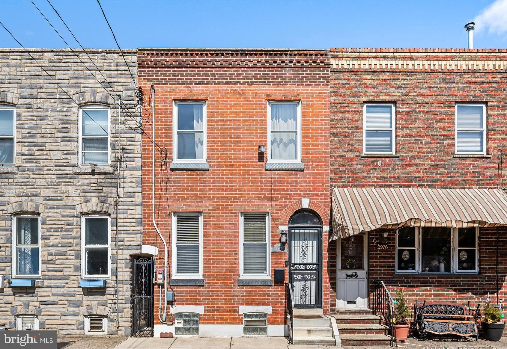 ***Open House canceled***
Welcome to 2974 E Thompson St., a beautifully maintained 3-bedroom brick-front home located in the heart of Port Richmond. The moment you walk through the tiled, glass-door vestibule, you're greeted by an inviting open floor plan, freshly painted, and filled with natural light.

The spacious living room and the adjoining dining area, feature large windows that create a bright and airy atmosphere, perfect for hosting and entertaining friends and family. This flows seamlessly into the kitchen which is equipped with stainless steel appliances, and ample cabinet storage. Just off the kitchen, a serene backyard awaits, complete with brick pavers and a grassy area, ideal for outdoor gatherings, gardening, or simply enjoying some quiet time.

The original staircase leads you up to the second floor where you'll find  inlaid hardwood floors. There are three bedrooms each with their own unique charm. The primary bedroom boasts an exposed brick wall, a custom closet system, and two large windows that flood the room with natural light. The updated bathroom includes a tub-shower combination, a skylight, and elegant wainscoting.

The middle bedroom, adorned with shiplap, makes for a perfect home office or nursery, while the third bedroom comfortably fits a queen-sized bed. And finally downstairs, a clean, dry basement offers plenty of storage space and also houses the laundry area.  The professionally  installed solar panel system on the roof helps offset electricity costs throughout the year. 

With a blend of classic charm and modern updates, this home is perfect for those seeking comfort and style in a prime Port Richmond location. You’ll be just steps away from popular neighborhood spots like Powers Park & Stokley Playground, Nemi, Gaul & Co, Tin Can, Taconelli’s Pizza, Ellie in Bird, Carbon Copy, Pizza Richmond, Big Top Vintage, and Sanavita Wellness. 2974 E Thompson St. is truly a great opportunity for you to call home.