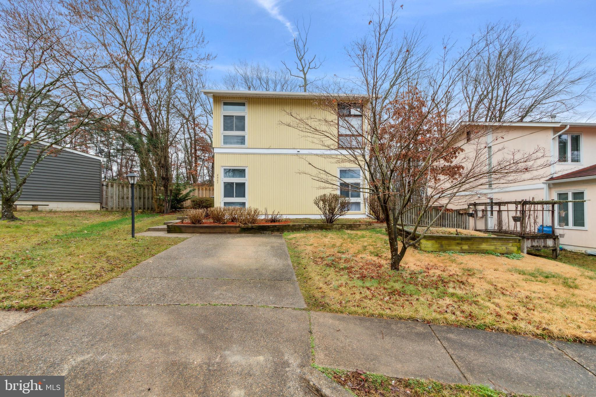 All Offers due by Tuesday, Feb 20 at 5pm. A decision will be made by 5pm on  Feb 21. Seller reserves the right to accept an offer earlier. Note: Broken  window glass repair to be completed by end of month. Glass on order. Beautifully  remodeled single family home in sought after Lake Ridge area! No HOA! This lovely 4 Bedroom, 2.5 bath home has a brand new roof and 2015 HVAC system and water heater.  New windows! As you enter this beautifully remodeled home the entrance way has a nice large closet. The Family Room is large and has floor to ceiling windows to allow the sunshine to pour in! The gorgeous Kitchen has new Stainless steel appliances with a gas stove with griddle, refrigerator with ice maker, dishwasher and built in microwave. The counter tops are granite. The Dining room is located right off the Kitchen. The main level has a bedroom and the new sliding glass door leads to a private patio with ceramic tile. There is also a large storage shed. The property backs to woods and goes beyond the fence. A half bath is located on the main level. Upstairs you will find the Primary Bedroom with it's own private bathroom. There is a private balcony off the primary bedroom. A great place to relax and have your morning coffee! There are two additional bedrooms upstairs with an additional full bathroom with a tub. Washer and Dryer located on main level. Washer is 1 year old. Dryer is new. All the sliding glass doors are new. Great home for a family. Lots of parking ! This home is located close to commuter lots bus transportation. VRE is nearby. Quantico and Ft Belvoir are less than 10 miles and the Pentagon is less than 30 minutes!