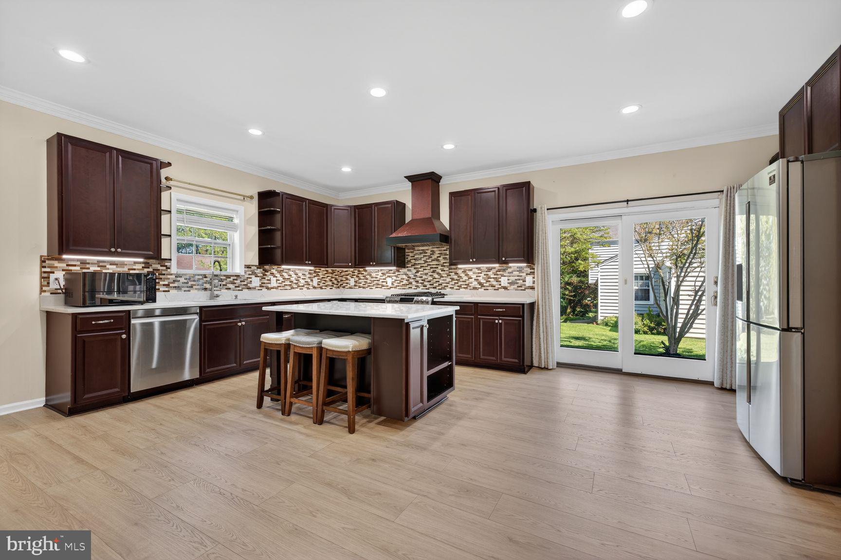 Welcome to this beautifully updated Colonial in Quince Orchard Knolls—a community known for its tree-lined streets, quiet charm, and unbeatable convenience.
<br><br>
This turnkey home features 3 finished levels, 4 bedrooms, 3.5 baths, and an oversized one-car garage. The main level offers brand-new LVP flooring, fresh paint, a living room, half bath, enlarged dining room, family room, and a rare main-level expansion with an extended family room and brand-new kitchen. The renovated kitchen features new cabinets, granite countertops, and a custom tile backsplash. The main level also includes a convenient laundry room with storage.
<br><br>
Upstairs offers four spacious bedrooms, including a primary suite with a walk-in closet and additional vanity area with quartzite counters. The finished lower level provides a large recreation room, full bathroom, and bonus room perfect for a home office, gym, or craft room.
<br><br>

Major updates include an expanded renovation/addition completed in January 2022, Bosch HVAC/AC system replaced in 2021, gas heat conversion with propane removed and gas line installed, new electrical panel in 2021, roof replaced in May 2025, new LVP flooring throughout all three levels, fresh paint, and many updated light fixtures and ceiling fans.
<br><br>

Enjoy a beautiful level backyard, ample storage/workshop space, plenty of off-street parking, and an HOA of only $60 per year. Conveniently located close to I-270, Metro, shopping, library, parks, schools, recreation, and the swim and tennis club.
<br><br>

This home is the perfect blend of comfort, elegance, and functionality—truly move-in ready and not to be missed!