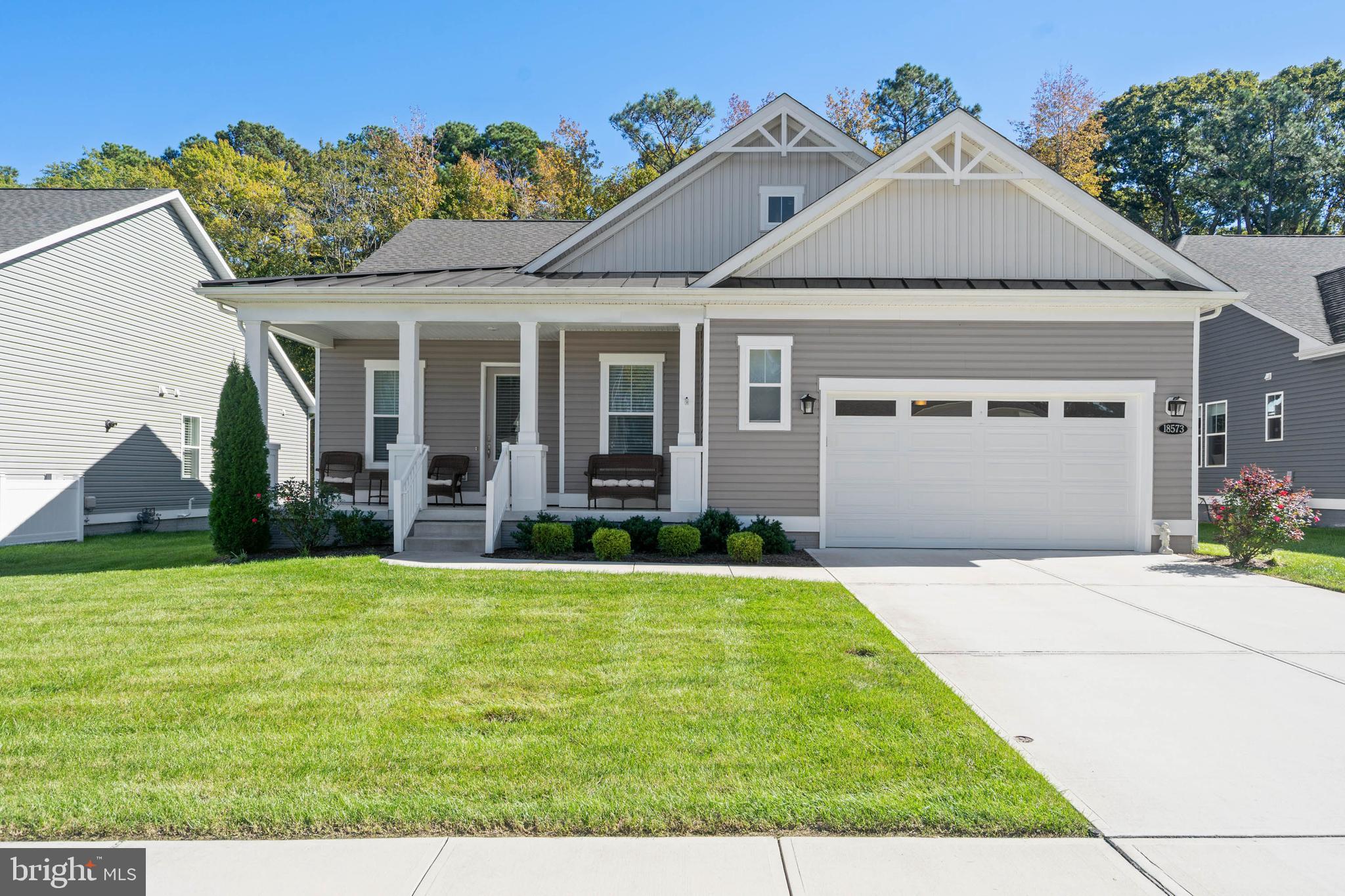 Refined One-Level Living on a Premium Homesite in Hawthorne!  Experience elevated coastal living in this beautifully appointed 3 Bedroom, 2.5 Bathroom residence offering 1,924 sq ft of thoughtfully designed single-level living.  Built in 2021 and ideally located between the charm of Georgetown and the coastal appeal of Lewes, this home combines modern sophistication with timeless comfort in one of Sussex County’s most desirable communities.  From the moment you enter, you are welcomed by soaring 12 foot ceilings and an open, light-filled layout designed for both effortless everyday living and elegant entertaining. The heart of the home is a gourmet chef’s kitchen of exceptional scale and style, anchored by a dramatic 12 foot quartz island and appointed with double wall ovens and a five burner gas cooktop. Seamlessly connected living and dining spaces create a refined yet relaxed atmosphere. An expanded owner’s suite, extended by four feet as a premium construction upgrade, offers a more spacious and private retreat. The ensuite bath evokes a spa-like experience, complemented by upscale finishes, while beveled edge luxury vinyl plank flooring flows throughout the main living areas for a clean, cohesive aesthetic.  Set on a premium homesite selected for its privacy and natural beauty, the property backs to forested land, an upgrade that offers a rare sense of seclusion and tranquility.  Outdoor living is equally exceptional, featuring a screened porch with a gas fireplace wrapped in a striking stone facade, creating a year-round gathering space that feels both intimate and refined.  A welcoming covered front porch adds to the home’s charm and curb appeal.  Additional high-value upgrades include a full lawn irrigation system servicing both front and rear yards, as well as interior access to the crawlspace via a full door and staircase leading to a concrete floor, offering convenience & storage rarely found in homes of this kind.  Residents of Hawthorne enjoy a vibrant community setting with close proximity to the beaches, dining, and recreation that define the coastal Delaware lifestyle. This is a rare opportunity to own a thoughtfully upgraded, impeccably maintained home where comfort, privacy, and quality come together seamlessly.  Fiber free home (i.e. no carpet).