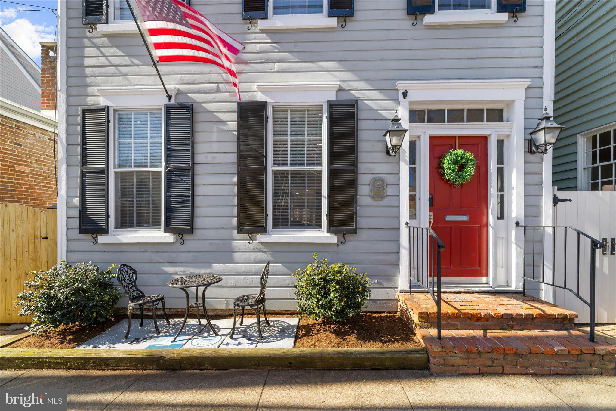 Exceptional new pricing creates a compelling offering in the heart of Historic Annapolis.  Located on one of the most charming and desirable streets in Historic Annapolis, this beautifully updated  home offers a rare combination of timeless character, thoughtful improvements, and an exceptional sense of space and privacy. With no direct neighbors in front or behind, the home enjoys an open, airy setting that is hard to find in such a prime downtown location.
Inside, historic details are thoughtfully complemented by modern updates throughout. The welcoming living room features a gas fireplace and sets the tone for the home’s warm and inviting feel. The kitchen and dining area flow effortlessly into a comfortable family room with a built-in bar—ideal for both everyday living and entertaining. 
Upstairs, three well-appointed bedrooms provide peaceful retreats, including a spacious primary suite with a private foyer, en suite bath, and access to a deck overlooking the backyard. From here, enjoy views of the Maryland State Capitol dome—an iconic Annapolis backdrop, especially when illuminated in the evening. A fully floored attic, accessible from the primary bedroom, offers generous storage across the entire footprint.
The outdoor space is equally impressive, featuring an expanded brick patio, new fencing, and landscaping that create a private and inviting setting for relaxing or entertaining. The roof has been replaced within the past six years, adding to the home’s overall upkeep and value.
Ideally located just steps from the waterfront, Ego Alley, the U.S. Naval Academy, Maryland Avenue, and Main Street, this home offers the very best of Annapolis living—historic charm, modern comfort, and an unbeatable walkable lifestyle. Its proximity to the City Dock Resiliency Project further enhances long-term appeal, reflecting the City’s investment in preserving and improving this treasured waterfront area for years to come.