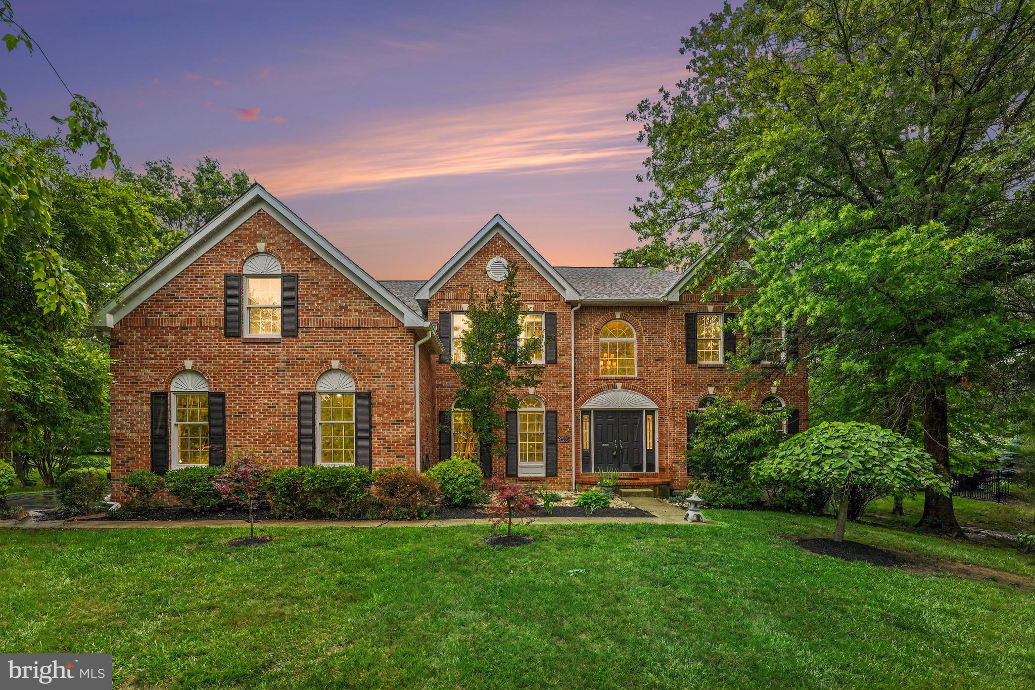 Welcome to this exceptional residence, gracefully situated in one of the area's most coveted neighborhoods. Showcasing a timeless brick façade, a three-car garage, and beautifully appointed living spaces, this home offers the perfect blend of luxury, comfort, and everyday functionality. Major improvements, including a six-year-old roof, four-year-old heater, and five-year-old central air system, provide added value and peace of mind. Thoughtfully designed for both elegant entertaining and everyday living, this home blends timeless architecture with beautifully updated spaces. Rich hardwood flooring extends throughout the first and second levels, with the exception of the private first-floor office. A dramatic two-story foyer, highlighted by an impressive open staircase, creates a stunning first impression. Formal living and dining rooms flank the entry, each enhanced with crown molding and chair rail detailing, while matching hallways lead seamlessly around the staircase to the heart of the home. The soaring two-story family room features vaulted ceilings and an open-concept design that flows effortlessly into the renovated kitchen. Designed with both style and function in mind, the kitchen showcases 42-inch white cabinetry, granite countertops, a marble backsplash, and an expansive center island with abundant storage, including six oversized drawers and six additional standard drawers. A spacious pantry, built-in cabinetry, and additional storage overlooking the family room ensure every culinary essential has its place. The first-floor office is a standout space, featuring floor-to-ceiling built-in bookcases that create the perfect setting for a sophisticated home office/workspace, or library for the avid readers. A tiled laundry room offers convenient access to both the rear yard and garage. The hardwood flooring continues throughout all four bedrooms on the upper level. Two bedrooms share a Jack-and-Jill bath, while a third enjoys its own private en-suite bath, creating an ideal layout for family and guests. Double doors welcome you into the luxurious primary suite, complete with a generous sitting room that provides a peaceful retreat. The customized walk-in closet offers exceptional organization with room to grow, while the spa-inspired primary bath overlooks the rear grounds and features dual vanities, a soaking jetted tub, and a separate shower. The finished lower level expands the home's living space with endless possibilities for entertaining and relaxation, offering an ideal setting for a media room, additional office, fitness area, or recreation space, complemented by a dry bar and abundant storage for seasonal décor and household essentials. Offering timeless finishes, exceptional functionality, and generous living spaces throughout, this distinguished home presents a rare opportunity to enjoy luxury living. Perfectly positioned to enjoy the best of both worlds, this home offers a peaceful, estate-like setting while remaining just minutes from the vibrant restaurants, boutiques, and year-round events of downtown Phoenixville. Convenient access to Routes 422, 29, 23, and the Pennsylvania Turnpike makes commuting to King of Prussia, Malvern, West Chester, and beyond effortless. Don't miss this exceptional opportunity. Schedule your private showing today.