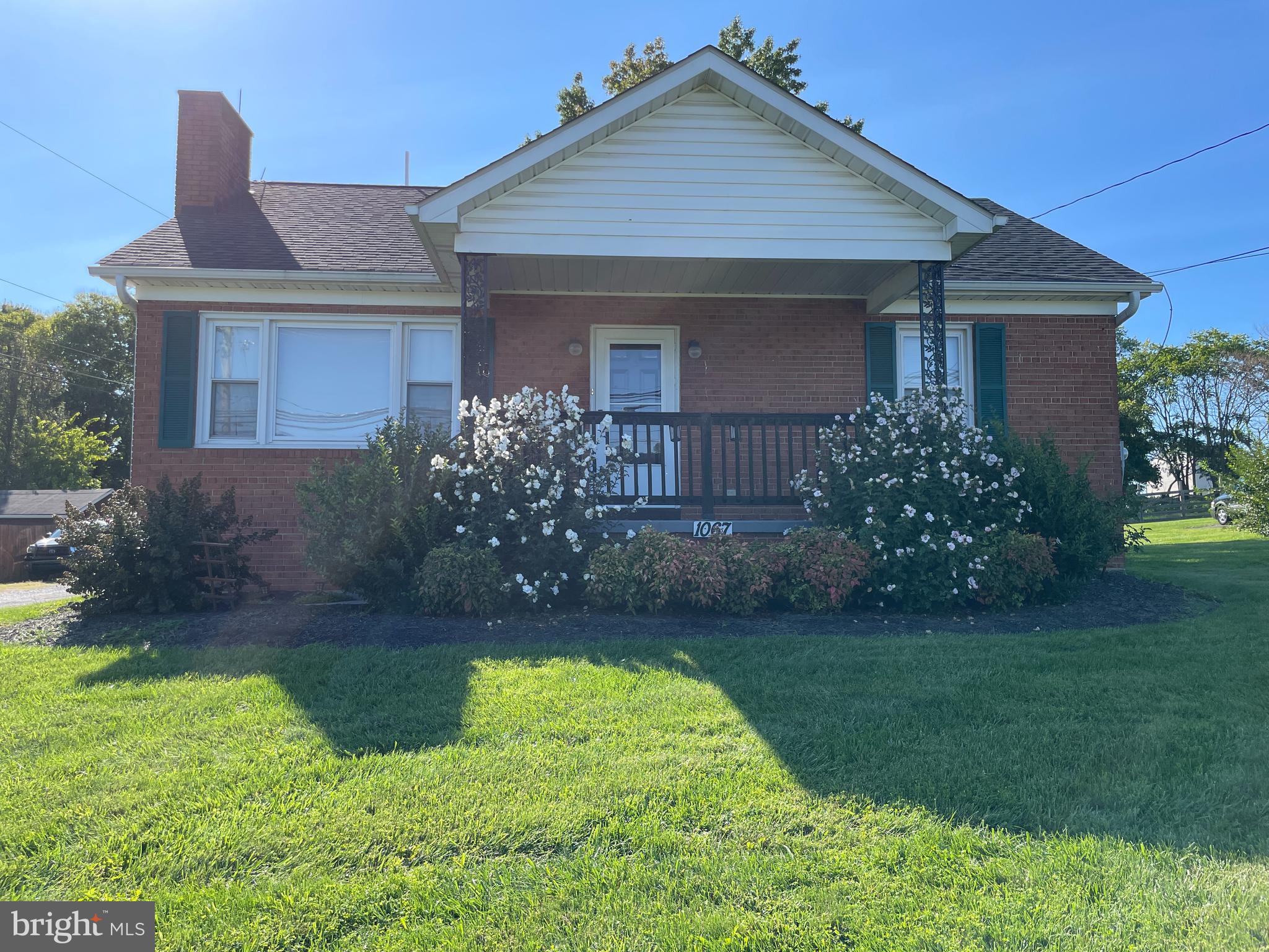 Cute Brick home offering cozy living room with fireplace, additional room off of kitchen could be used for dining room or office area.  Offering the charm of an older home with built in China cabinet and original kitchen cabinets (originally from Hagerstown) that seller has refinished immaculately.  Enclosed rear porch with steps leading to unfinished concrete basement that could be finished for more living space.  Nice size lot with additional outbuilding with electric & additional shed to store your mower & gardening tools.
 Excellent commuter location.   No HOA fees or restrictions!