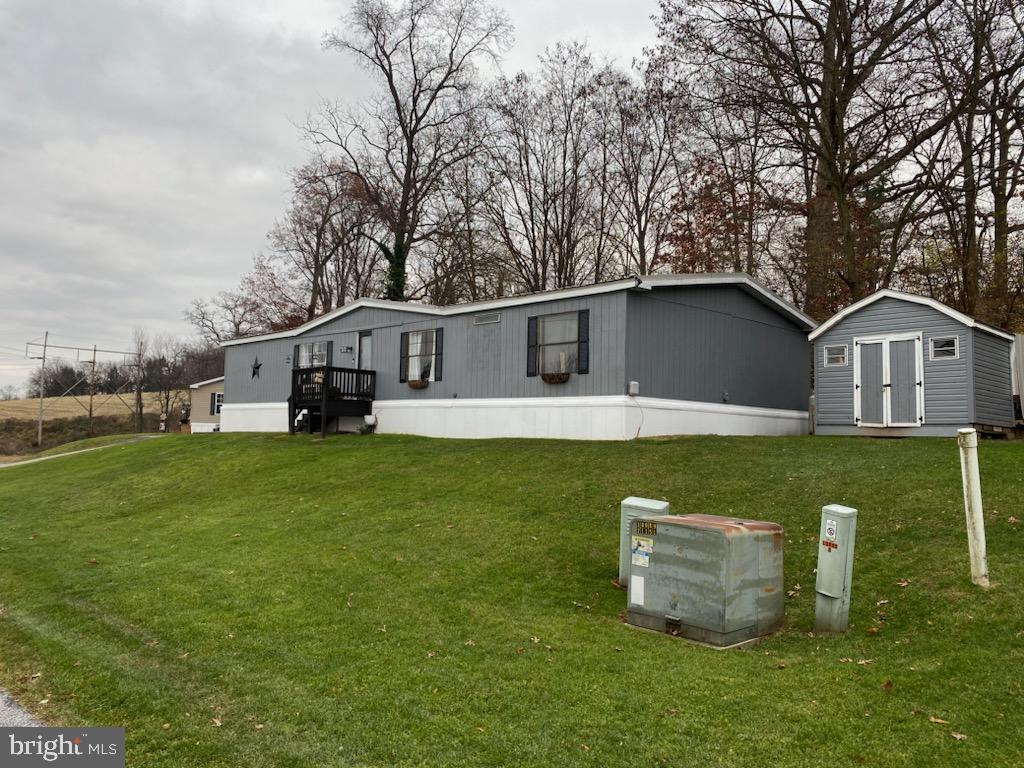 Step into this spacious, inviting double wide mobile home in Dallastown SD, offering a perfect blend of comfortable living and affordability. With a living area and separate family room with a beautiful stone fireplace, this residence is ready to become your cozy haven. Enjoy the luxury of space with 3 bedrooms and 2 full newly remodeled bathrooms including a primary suite.  The kitchen is a chef's dream, featuring an open floor plan, ample counter space, and an Island for your cooking and entertaining enjoyment. The dining area is ideal for hosting family gatherings or intimate dinners. Step outside to the large front yard, perfect for relaxing evenings or outdoor activities. The spacious side yard provides a great spot for weekend barbecues or room for children to play. With 2 designated parking spaces and a storage shed, this property offers convenience and practicality.  Situated in M & G MHP, this home offers proximity to restaurants, shopping, and Interstate 83, providing a convenient lifestyle. Fresh paint inside and out, luxury vinyl plank flooring,  and many updates including drywall throughout, make this home a joy to own.
Upgraded insulation in the ceiling and under the home, along with a newer metal roof, offer a low maintenance, energy efficient home.
Contact me today to schedule a tour and make this charming residence yours!
2723 S QUEEN ST. IS THE ADDRESS OF THE MHP. PLEASE FOLLOW THE DIRECTIONS IN THE LISTING. LOOK FOR THE SIGN IN THE YARD.