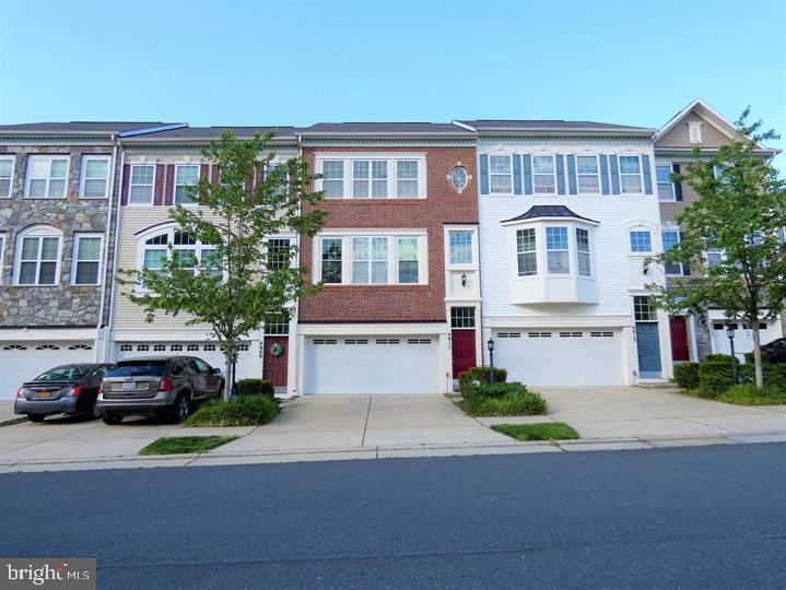 Stunning 3-level townhome nestled in the desirable Potomac Highlands community. This home offers a captivating open floor plan with a well-appointed eat-in kitchen features granite countertops and gleaming hardwood floors, adding a touch of elegance to the space. Step outside onto the spacious deck, an ideal spot for grilling and basking in the warmth of sunny days. Upstairs, the upper level showcases three inviting bedrooms, two full baths, and a conveniently located laundry area. The master bedroom is a true retreat, boasting two walk-in closets and a luxurious ensuite bathroom complete with a soaking tub and separate shower. The lower level presents a cozy rec room, providing an excellent space to unwind. With bright windows and a walkout to a grassy common area, this level offers a seamless blend of comfort and convenience. The attached two-car garage ensures hassle-free parking and additional storage. Enjoy the perks of low-maintenance living in this community, as lawn care, trash, water, snow removal, and exterior property insurance are all covered by the association fees. Take advantage of the fantastic amenities, including a community pool and playgrounds, creating a vibrant and inclusive atmosphere. Conveniently located near commuter routes, shopping centers, and entertainment venues, this townhome offers the perfect balance of tranquility and accessibility. Don't miss the opportunity to make this gorgeous townhome your own. Schedule a showing today and experience the epitome of comfortable and stylish living in Potomac Highlands.