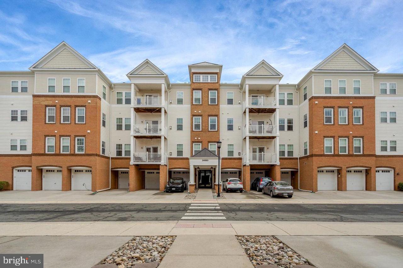 Beautiful, spacious, and modern condo with an open floor plan in a highly sought after community. The building offers elevator access for added convenience and a secure entry call box. Inside, you will find beautiful hardwood flooring, freshly painted walls, and new wood flooring that add a fresh and updated feel throughout the home.

The kitchen features granite countertops, stainless steel appliances, a double oven, under cabinet lighting, and lower cabinets with slide out organizers. The oversized walk in pantry is a standout feature with custom wood shelving. The living area offers a lovely fireplace, perfect for cozy evenings.

This condo includes 3 bedrooms, 2 full bathrooms, and a dedicated office space. The owner’s suite offers an en suite bathroom with double sinks, a walk in shower, and a large walk in closet with professionally installed shelves and rods. The second bedroom also includes professionally installed shelves and rods. Decorative blinds and tiled bathrooms add to the home’s appeal.

Extra large one car garage, rarely available in the community. Trash room and mailboxes are conveniently located inside the building. The outside AC unit was replaced in 2024.

Ideally situated in a premier location, this condo is surrounded by upscale shops, restaurants, and top rated Loudoun County public schools, with easy access to Dulles South Recreation and Community Center.