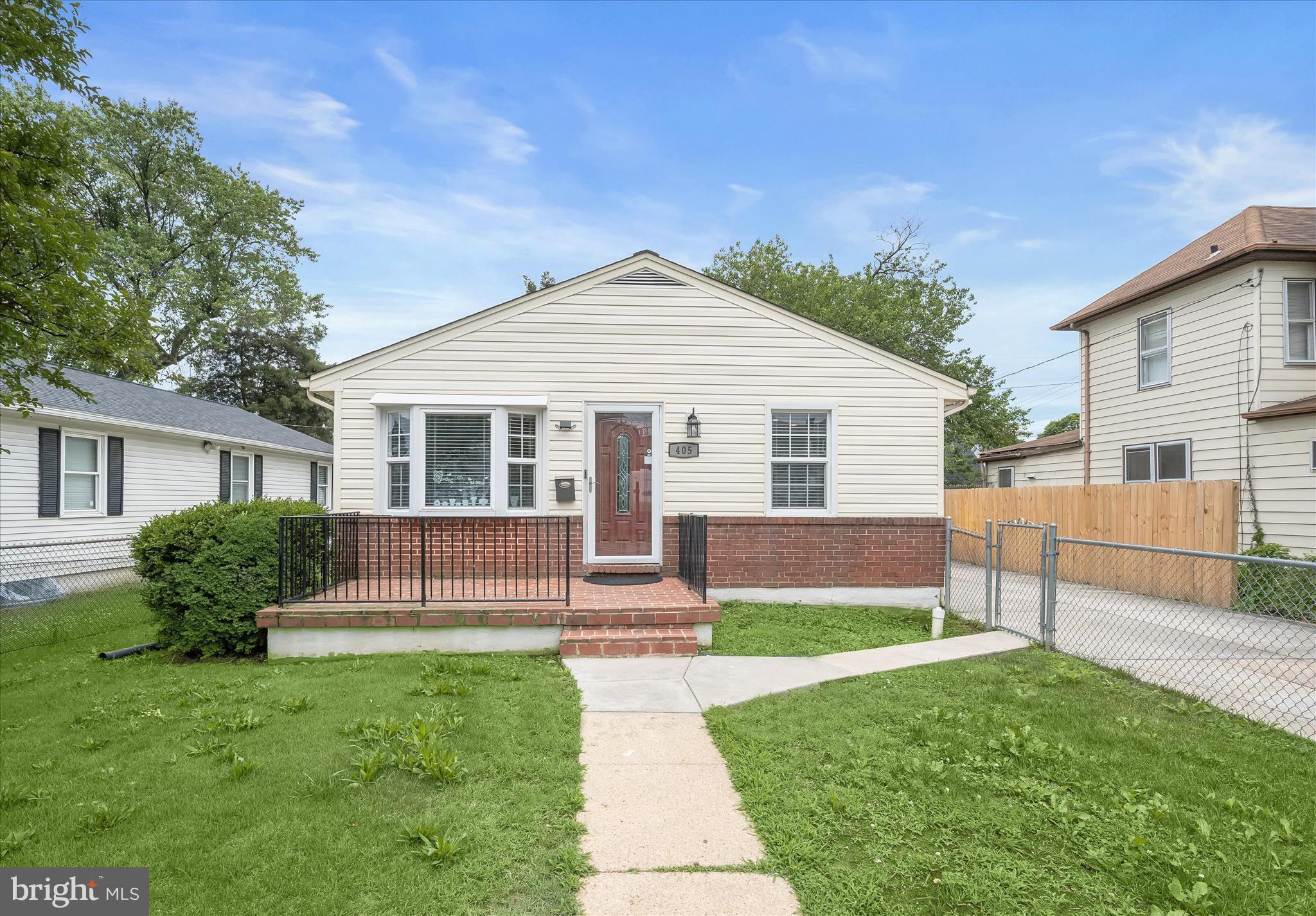 This updated ranch home blends classic comfort with thoughtful modern upgrades, offering a layout designed for both everyday living and easy functionality. A convenient fenced front yard sets a welcoming tone, while a spacious driveway provides ample parking.
Step inside to a bright living room featuring hardwood flooring that extends through most of the main level, along with a charming bay window that brings in natural light. The living room flows seamlessly into the adjacent dining area, which connects openly to both the living space and the kitchen, creating an easy, connected feel throughout the main living areas.
The updated kitchen is well-appointed with granite countertops, sleek cabinetry with soft-close drawers, and stainless steel appliances, including a gas range. A side door off the lower-level landing provides direct access from the driveway into the kitchen, adding everyday convenience for coming and going.
The main level includes three comfortable bedrooms and a full bath with a tiled tub and shower surround and a granite counter vanity, offering a clean and modern finish. Downstairs, the fully finished lower level expands the living space with a large family room, a full bath, a dedicated laundry and utility room with additional storage, and a versatile bonus room ideal for a home office, hobby space, or guest use.
Recent improvements provide added peace of mind, including a replaced dishwasher, washer and dryer, sump pump, and sewer line from the house to the street. Outdoor living is enhanced with a fenced backyard featuring privacy fencing, creating a usable and secluded space for relaxing or entertaining.
The area offers convenient access to everyday essentials, nearby parks, local schools, and shopping and dining along key corridors such as Patapsco Avenue and South Hanover Street. Commuters benefit from easy access to public transit and routes into downtown Baltimore, while nearby Masonville Cove and additional South Baltimore green spaces provide opportunities for waterfront recreation and outdoor enjoyment.