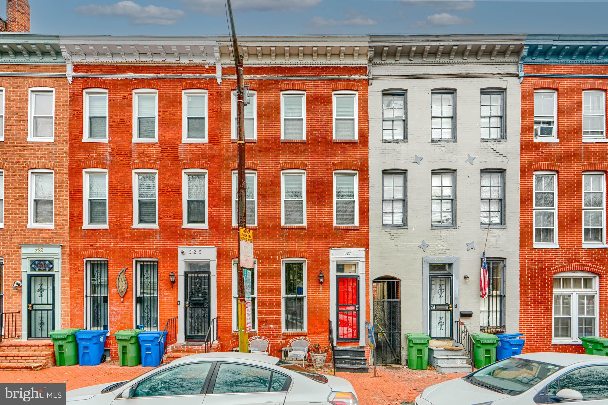 Back on the market with a huge price improvement!  Wonderful opportunity to own in the hot historic Ridgely Delight neighborhood!  This charming three-bedroom, 2.5-bathroom home will check all the boxes on your “must have” list without breaking the bank.   This home has incredible historic integrity, with an original staircase, fireplace, and exposed brick, along with all the updates you desire for comfortable living.  The first floor includes hardwood floors, a convenient powder room,  designated dining, and access to a private patio.  Upstairs are two large bedrooms at the separate ends of the home for total privacy, and one full bathroom with a large tub.  The top floor is your private primary suite, with an additional washer-dryer hookup and an en-suite full bathroom.   The basement, equipped with a washer-dryer and a utility sink, is the perfect place for all your storage needs.  All of this is located steps from UMMC, UMBC, Camden Yards, JHU, and the Inner Harbor for well under 300K! This home is a no-brainer for the savvy investor looking to add to their rental portfolio or the first-time buyer on a budget.  AS IS Seller will not make repairs.