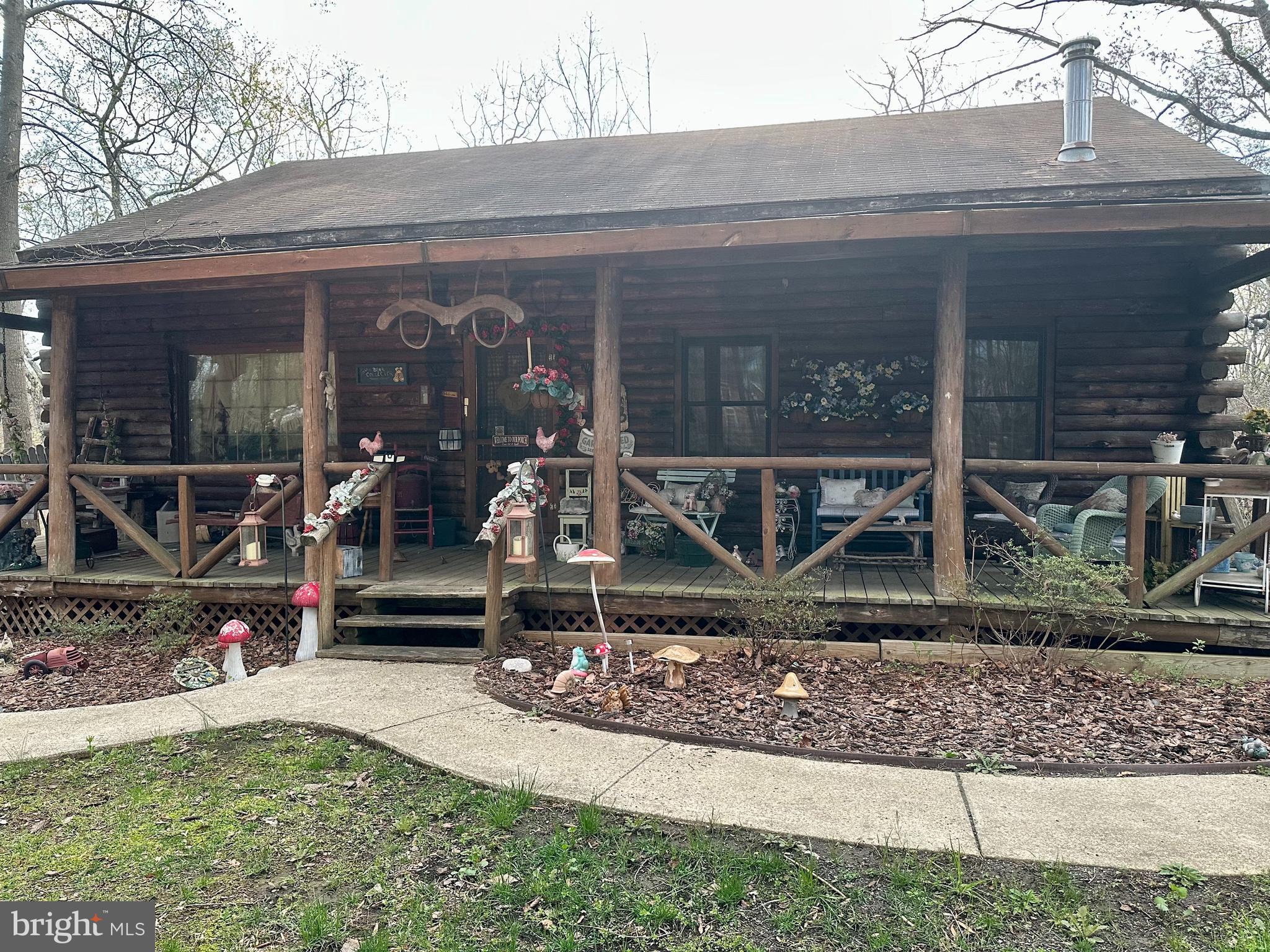 Presenting a rare opportunity to acquire 5.36 acres in Annapolis, featuring a distinctive log home that blends charm with potential. Constructed in 1984, the home includes four bedrooms, three full bathrooms, and a fully finished walkout basement. The basement offers versatility for additional living space, a home office, or potential rental income. Tucked away at the end of a quiet street on a private, wooded lot, this property offers a serene and secluded setting, perfect for those seeking privacy and tranquility, yet conveniently close to shopping, dining, and major commuter routes. Additionally, the property provides the unique possibility of constructing a second home. This is a rare chance to own substantial acreage in an exceptional location—don’t miss out on making this remarkable property your own.