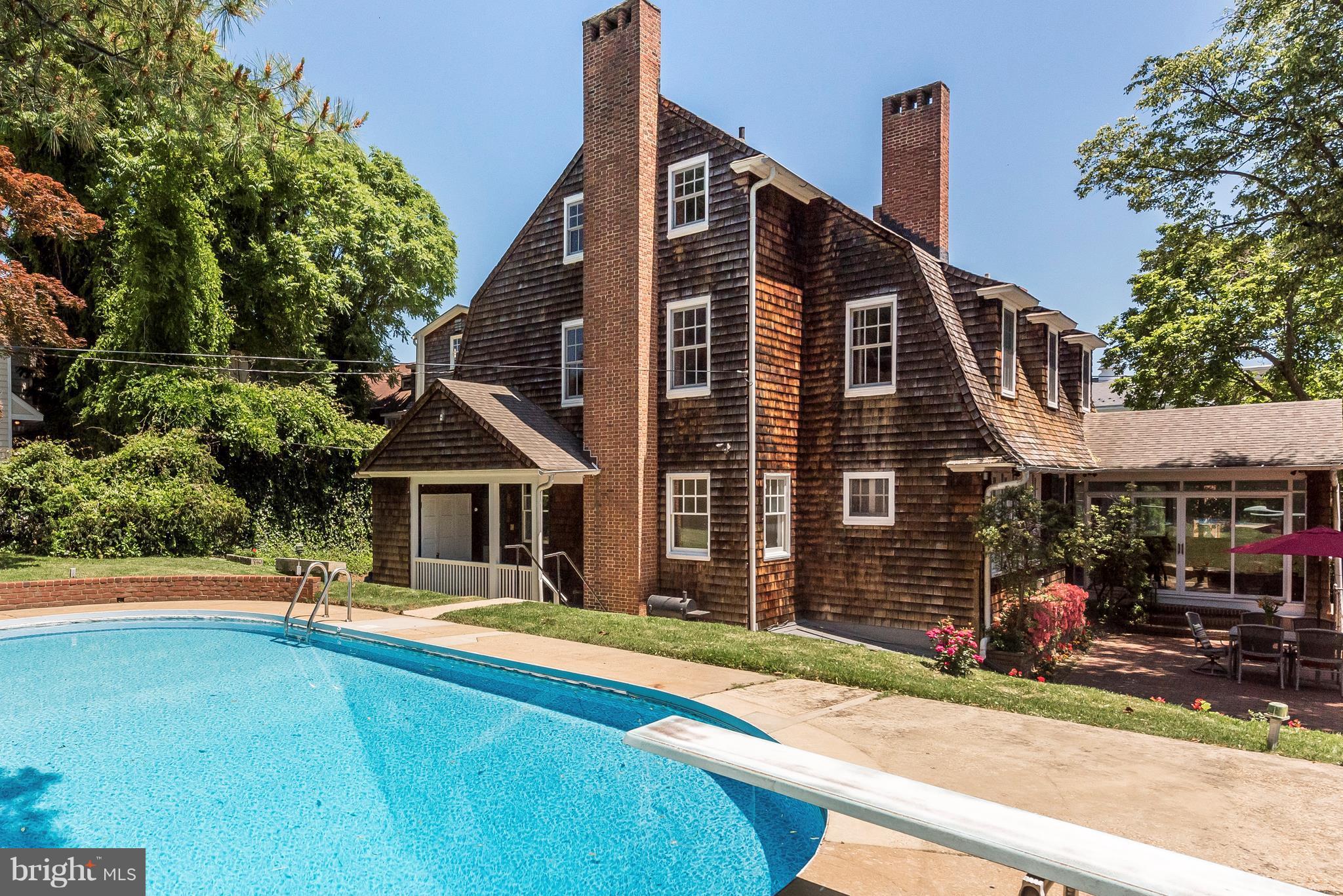 1 short block to Church Circle on .26 acres this home has it all Carport parking & in-ground pool!Only 3 owners,110 yrs! Beautiful, important Shingle-style home on 3 levels w/ lg sunny rms, marries recent modern updates w/ original trim & doors, banks of pretty leaded glass windows, beamed ceilings & walls,graceful staircase&long leaf pine flrs.Good bathrooms,closets &storage+lg. terrace.Gorgeous!