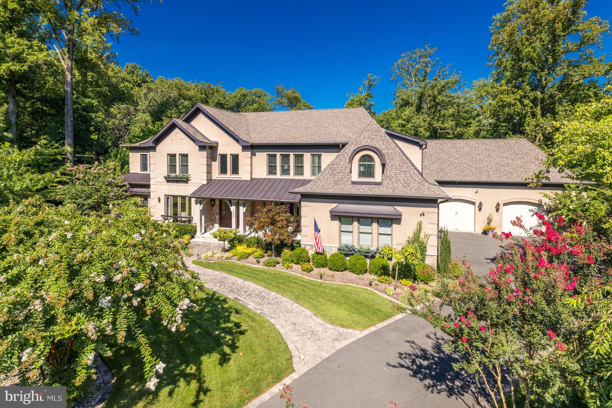 This one-of-a-kind offering in the sought-after neighborhood of Franklin Park has been professionally landscaped and hardscaped and is spectacularly sited on a .71 acre lot. The all brick home offers approximately 11,000 SF on 3 levels with a 5-car garage, screen porch and elevator.
 
No detail has been overlooked in the impeccable design and thoughtful floor plan of this well-appointed and turn-key residence, built in 2017 by CRT Builders. With its 6 bedrooms, 6 full and 3 half baths, this transitional-style home has an open floor plan, 10ft ceilings and host of exceptional amenities.
 
Walls of windows invite an inpouring of natural light, epitomized in the 2-story foyer with soaring ceiling and roof-level windows. The distinct yet understated elegance continues into the formal living and dining rooms, a fabulous gourmet kitchen with high-end appliances including 2 dishwashers, a built-in espresso machine, oversized range, wall ovens, etc. highlighted by custom cabinetry, quartz counters and adjoining breakfast and family rooms with multiple French doors to exterior. There is a large walk-in pantry and butler’s pantry, and a side garage-entry mud room with a family powder room and back stairs. A paneled library, screened porch and formal powder rooms complete the main level. Two stair cases connect to the upper floors, and an elevator also provides access to all levels.
 
Comprising the 2nd floor are 5 separate bedroom suites each with ensuite bathrooms and walk-in closets, a separate walk-in cedar linen closet, and one of 2 massive laundry rooms. The master suite is its own paradise with a sitting room, fireplace, custom closets, and incredible spa bath with heated floors and a large shower. 
 
The finished lower level presents large family rooms, a fully outfitted bar with dishwasher and beverage refrigerator, theatre, wine room, catering kitchen with the second laundry, doors that walk-out to flagstone patio, guest bedroom suite (or exercise room) with walk-in closet and full bath, an additional powder room and a large storage area.
 
Terrific outdoor living space features very private and usable side and rear yards with mature plantings and trees, a large deck, and screen porch which lead down to a beautiful patio with built-in grill, fireplace all with automated smart lighting and irrigation.
 
Rounding out the amenities are a generator, a central vacuum,  audio system, whole house security and a large safe. Do not miss seeing this residence, which pays homage to the charm of East Coast tradition yet incorporates the finest modern style, luxury materials, and finishes.
 
Franklin Park is known for its lush natural landscape, mature trees, and charming rolling hills. This home offers access to the best of McLean with its close proximity to all the Downtown McLean and Downtown Arlington have to offer. It is ideally situated just minutes to the George Washington Parkway, I-66, Tyson's Corner, and the Capitol Beltway.
