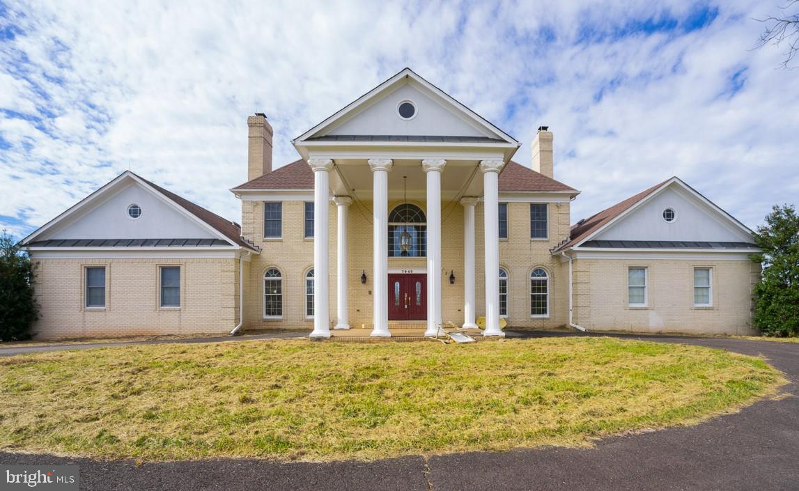 Magnificent, elegant manor home on 10.9 acre rural retreat!  Pastoral views of farmland, horse pastures, and rolling, wooded hills in every direction from this hilltop vantage point.  Nearly 6,000 finished square feet of comfortable luxury including marble floors, hardwood floors, decorative columns, soaring two-story foyer with dual curved staircases, five fireplaces!  Voluminous family room with stone fireplace and flanking built-ins is the centerpiece of the home, overlooking and opening to the enormous wrap-around deck.  Formal dining room with fireplace, elegant d cor, and mirrored wall.  Main level master suite with fireplace and deluxe master bathroom!  Home office with hardwood floors, matching built-in wooden desks and bookshelves.  Wrap-around deck with gazebo overlooks a two-story, 4-stall horse barn with electric and water!  Finished basement features an indoor hot tub, sauna, and steam shower!  New HVAC systems, new roofs on home and barn.  Property is in good condition overall, but is being sold "As Is".